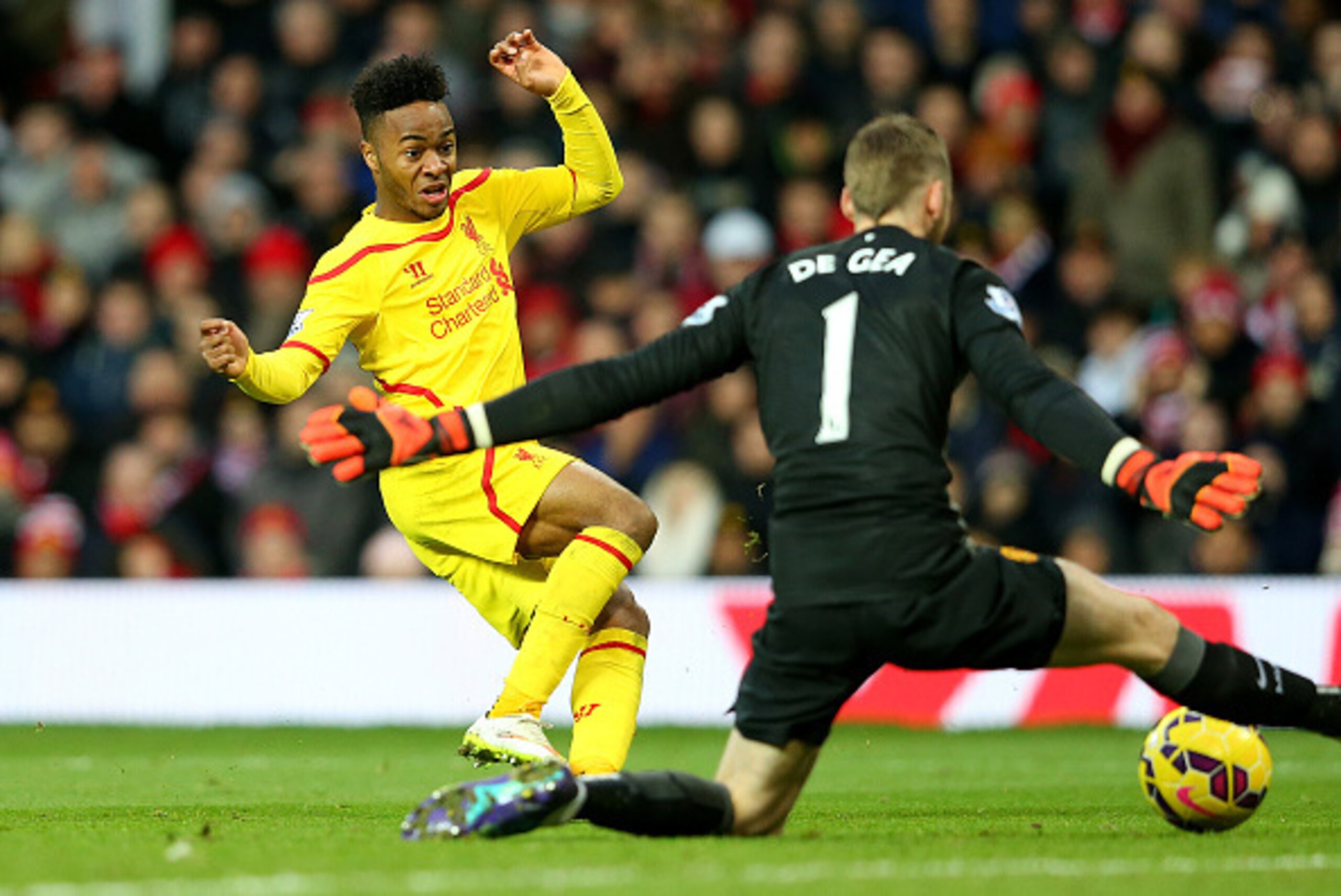 MANCHESTER, ENGLAND - DECEMBER 14:  Dvid De Gea of Manchester United saves the attempt on goal of Raheem Sterling of Liverpool in a one on one situation during the Barclays Premier League match between Manchester United and Liverpool at Old Trafford on De