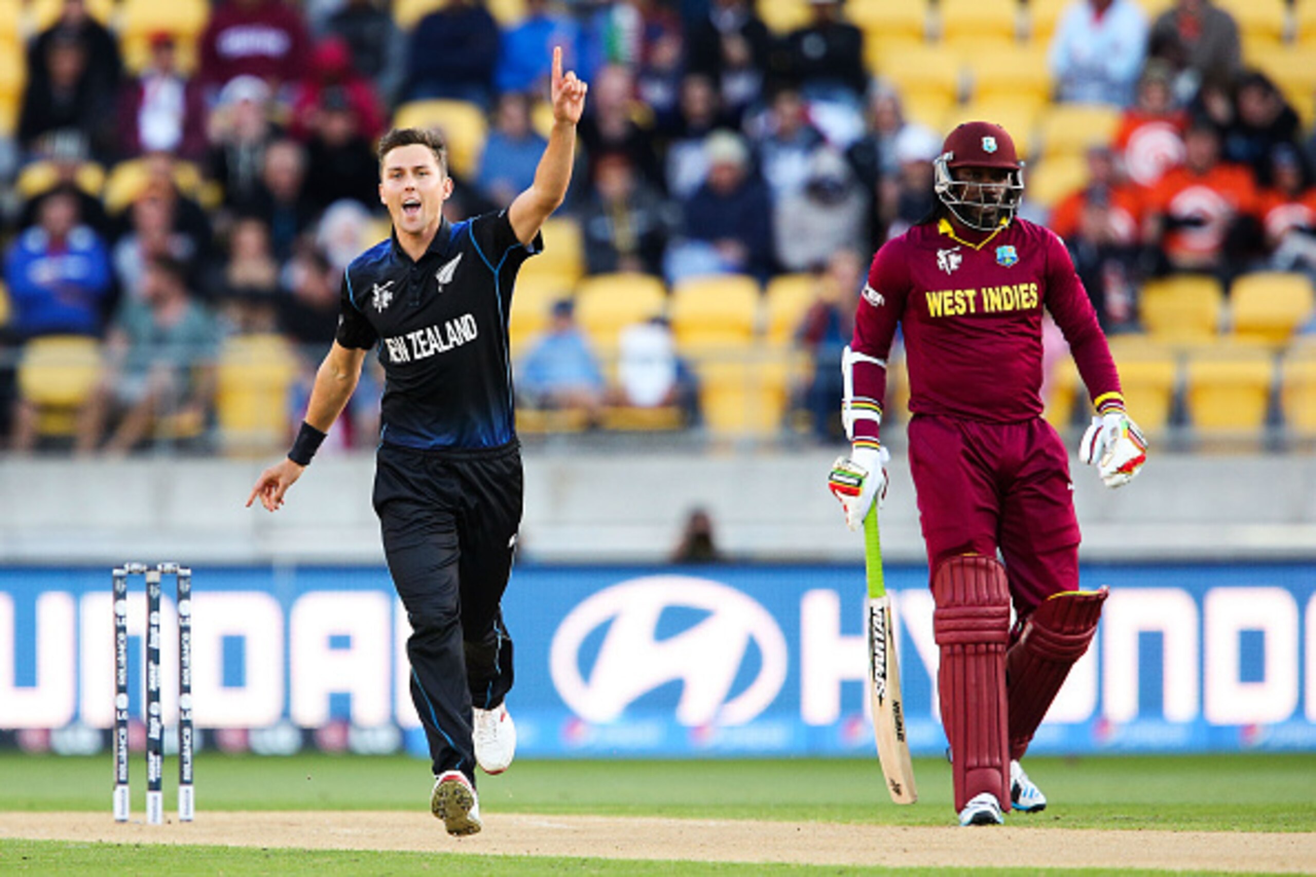 WELLINGTON, NEW ZEALAND - MARCH 21: Trent Boult of New Zealand celebrates after taking the wicket of Johnson Charles of the West Indies while Chris Gayle looks on during the 2015 ICC Cricket World Cup match between New Zealand and the West Indies at Well WELLINGTON, NEW ZEALAND - MARCH 21: Trent Boult of New Zealand celebrates after taking the wicket of Johnson Charles of the West Indies while Chris Gayle looks on during the 2015 ICC Cricket World Cup match between New Zealand and the West Indies at Well