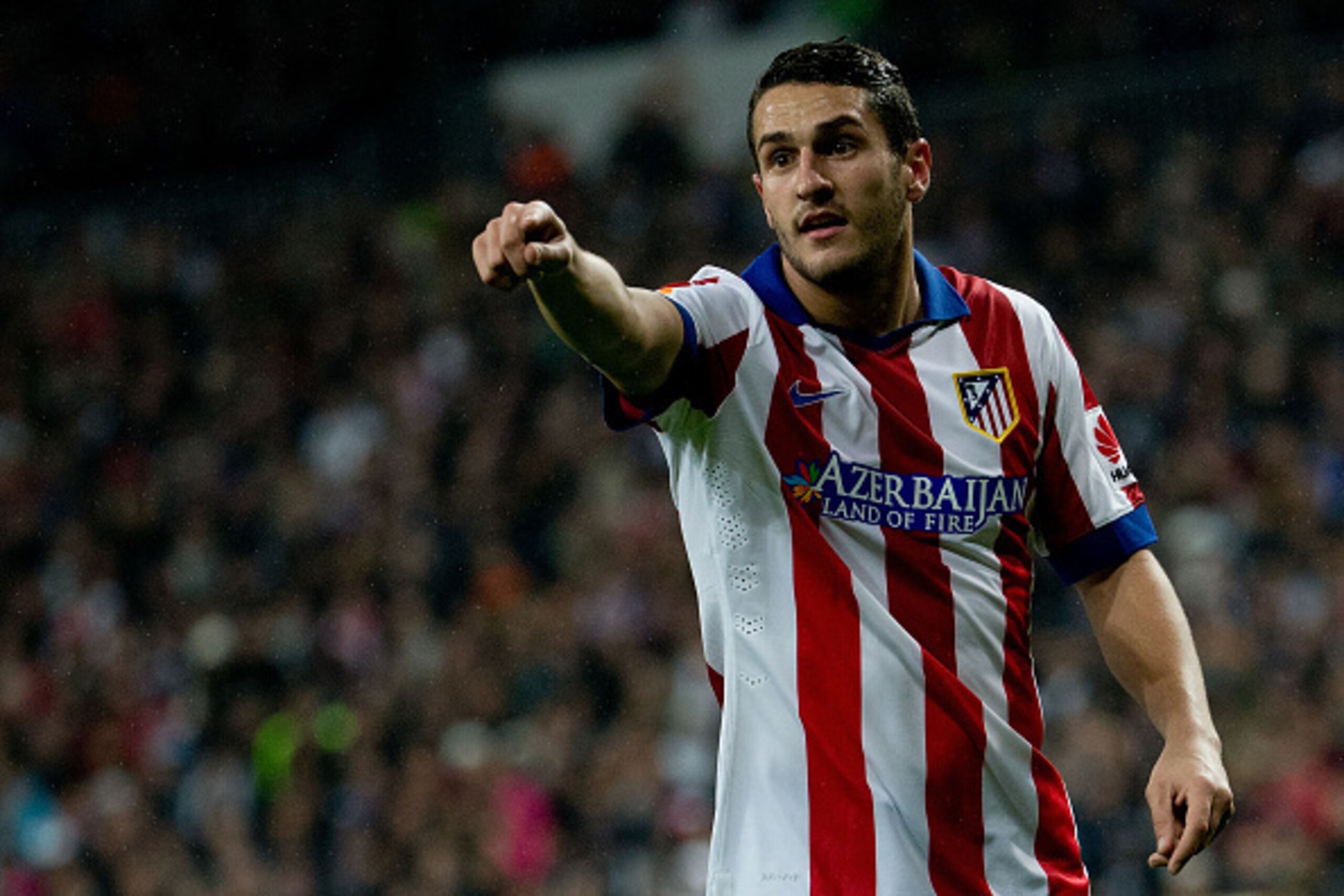MADRID, SPAIN - JANUARY 15: Koke of Atletico de Madrid gives instructions to thier teammates during the Copa del Rey Round of 16 second leg match between Real Madrid CF and Club Atletico de Madrid at Estadio Santiago Bernabeu on January 15, 2015 in Madri MADRID, SPAIN - JANUARY 15: Koke of Atletico de Madrid gives instructions to thier teammates during the Copa del Rey Round of 16 second leg match between Real Madrid CF and Club Atletico de Madrid at Estadio Santiago Bernabeu on January 15, 2015 in Madri