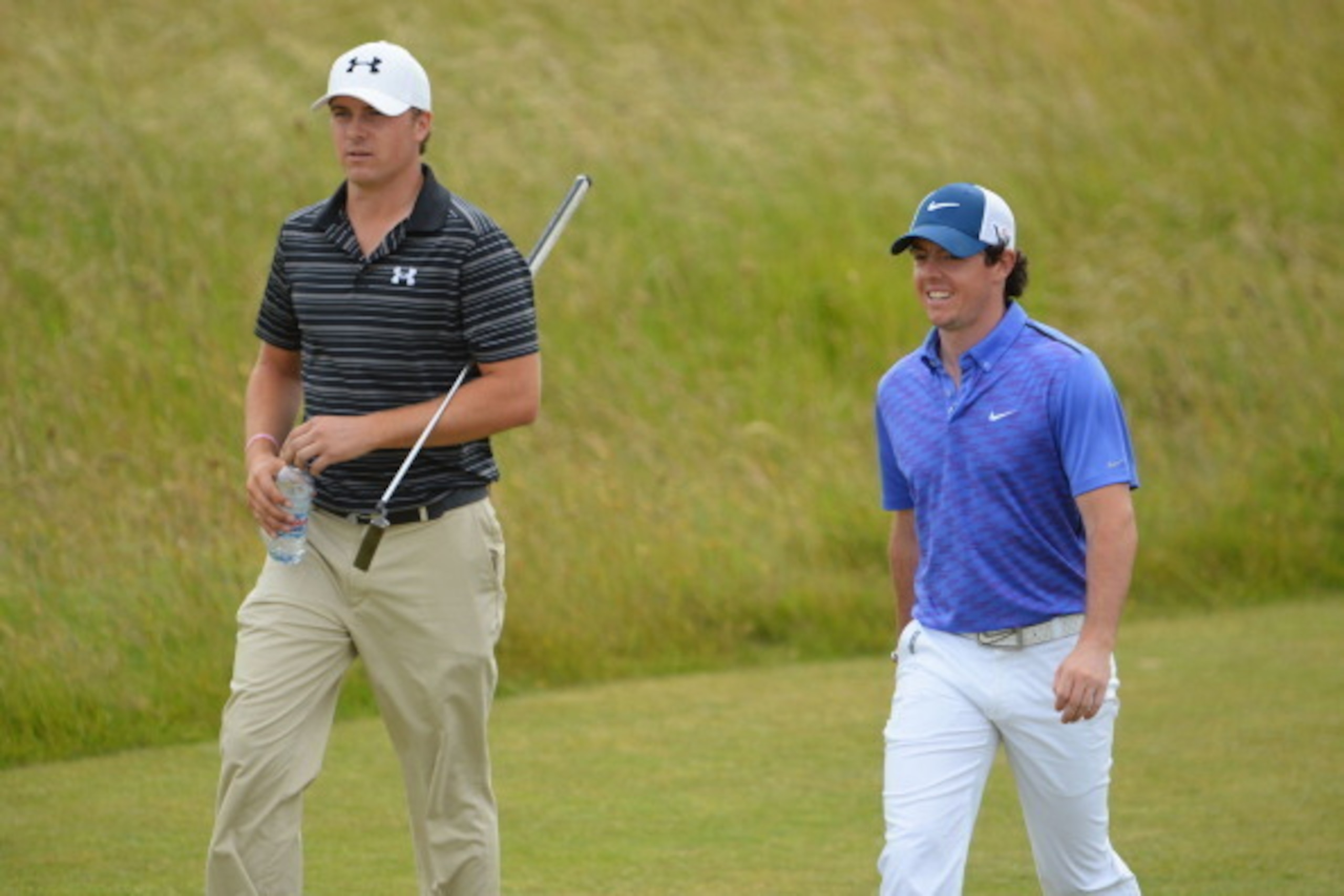 GULLANE, SCOTLAND - JULY 17:  Rory McIlroy of Northern Ireland and Jordan Spieth of the United States walk along the fairway ahead of the 142nd Open Championship at Muirfield on July 17, 2013 in Gullane, Scotland.  (Photo by Stuart Franklin/Getty Images)