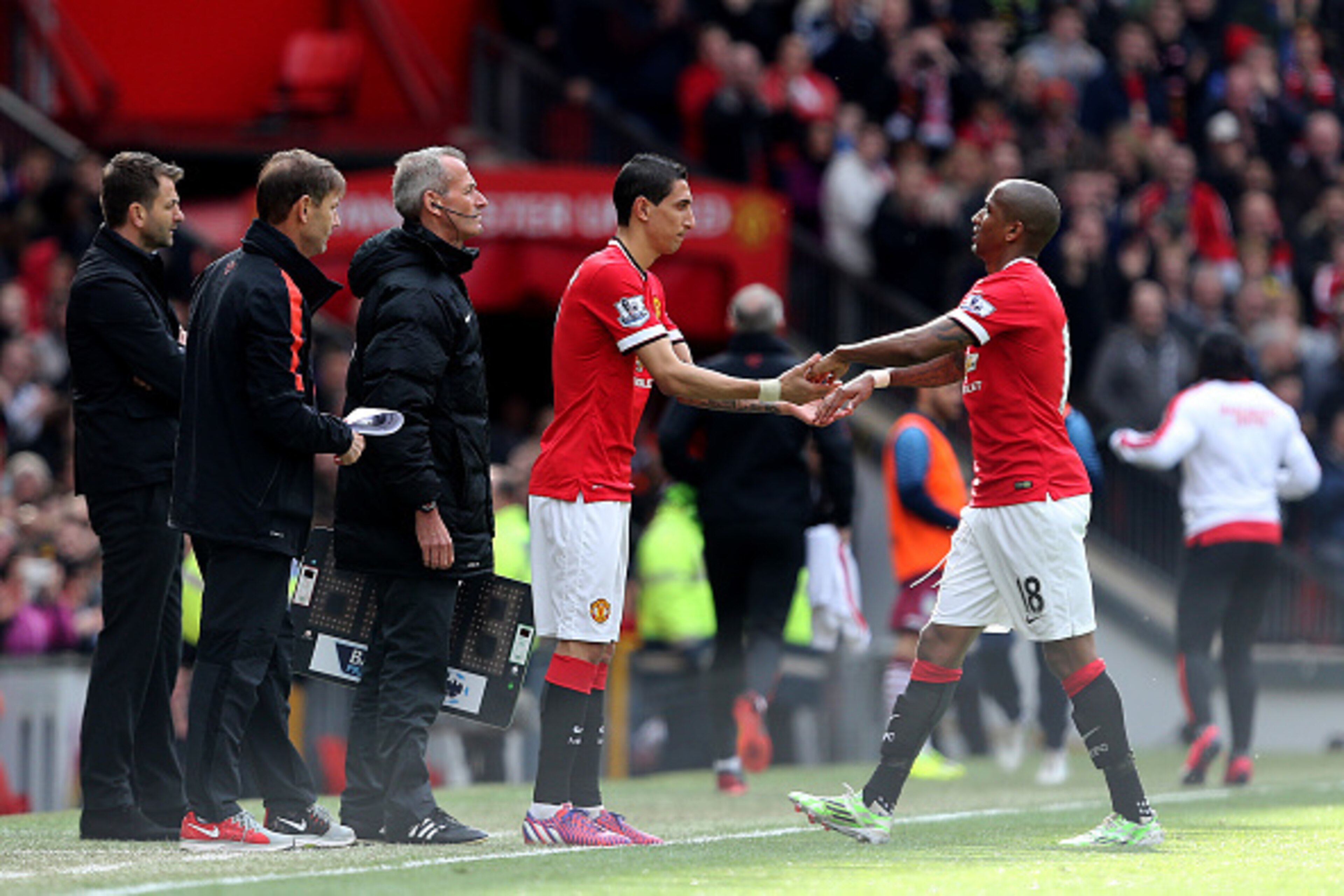 MANCHESTER, ENGLAND - APRIL 04:  Ashley Young of Manchester United is replaced by Angel di Maria of Manchester United during the Barclays Premier League match between Manchester United and Aston Villa at Old Trafford on April 4, 2015 in Manchester, Englan