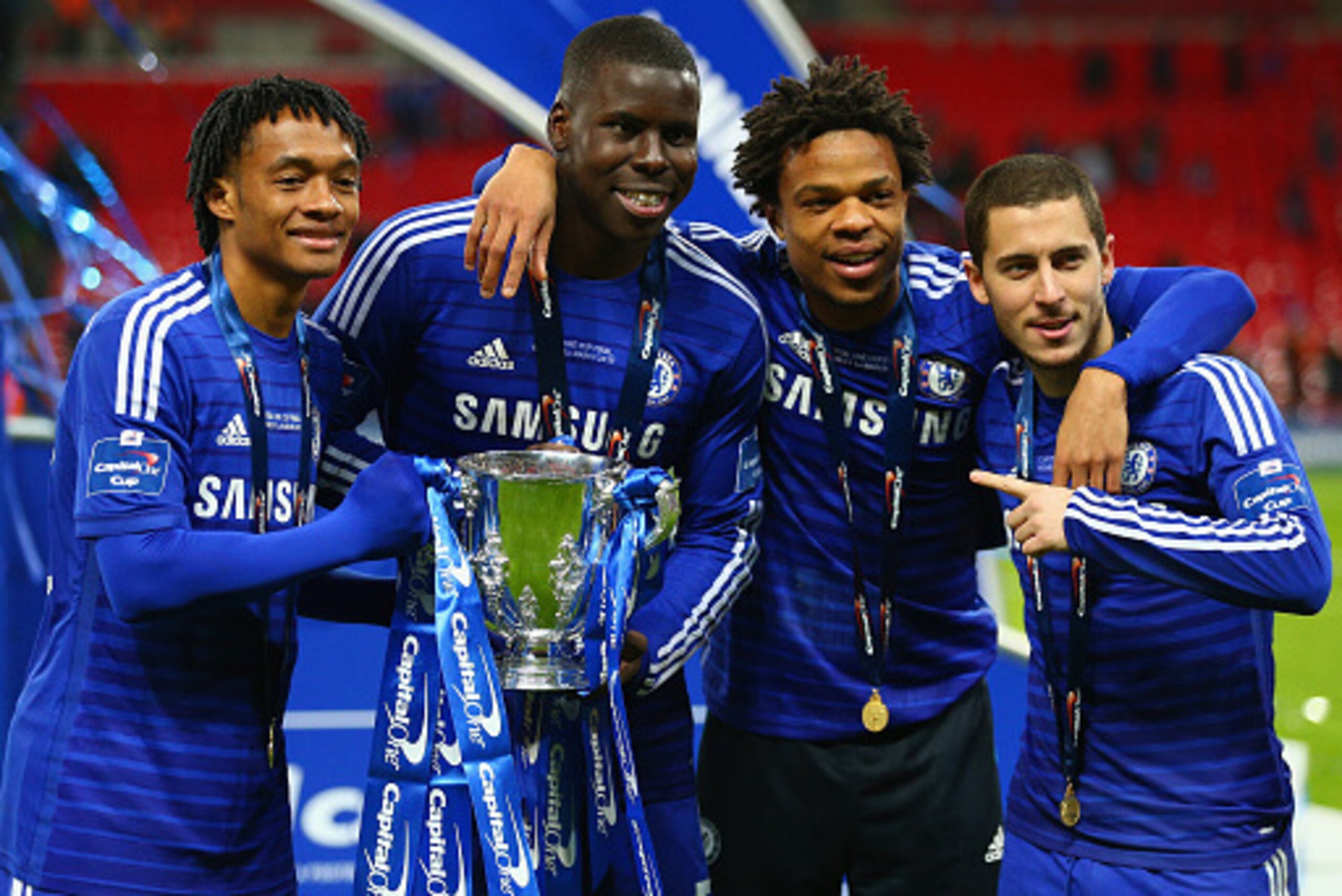 LONDON, ENGLAND - MARCH 01:  Juan Cuadrado, Kurt Zouma, Loic Remy and Eden Hazard of Chelsea pose with the trophy during the Capital One Cup Final match between Chelsea and Tottenham Hotspur at Wembley Stadium on March 1, 2015 in London, England.  (Photo 