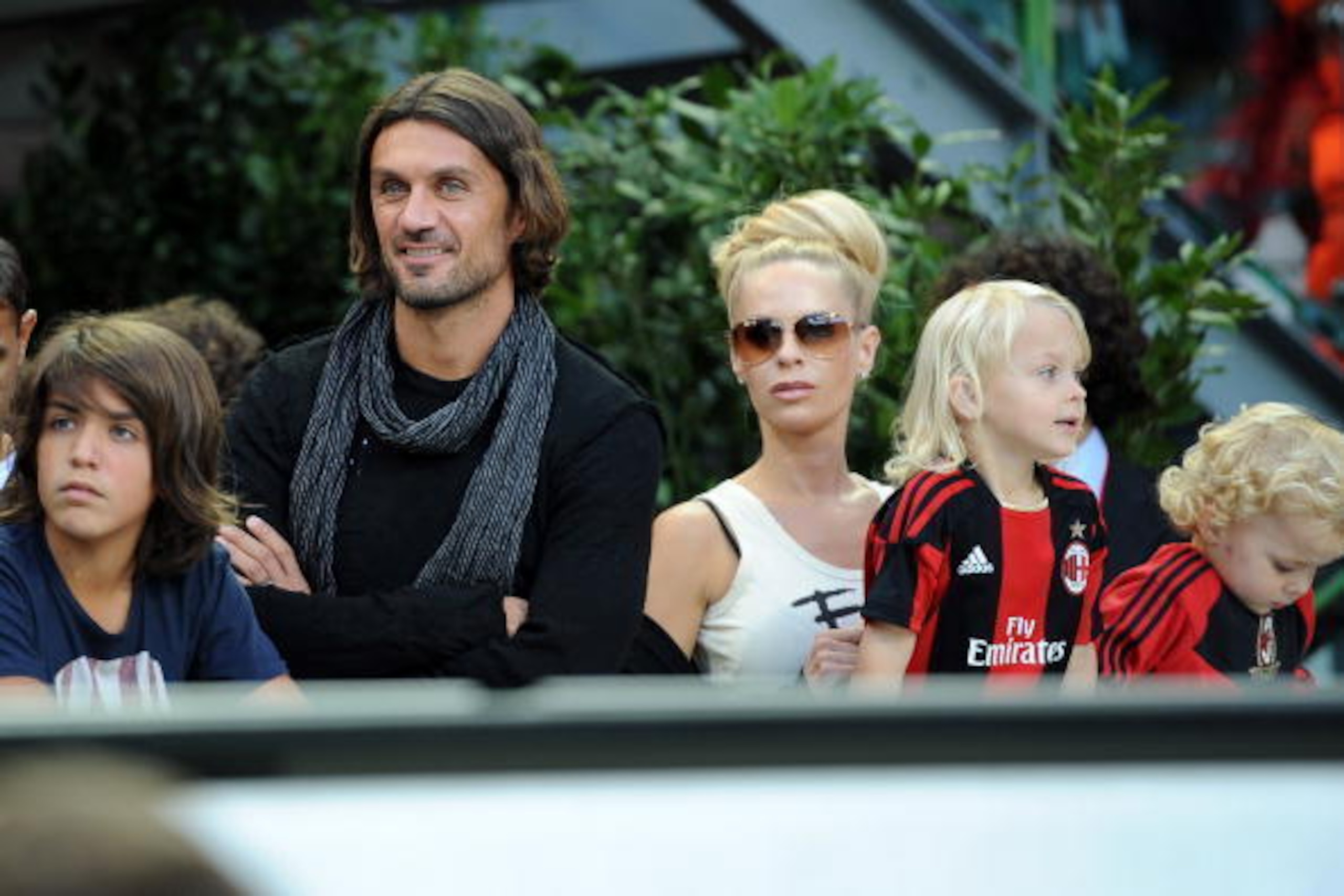 MILAN, ITALY - SEPTEMBER 26:  Former captain of Milan Paolo Maldini (2nd-L), his son (L), Helena Seger Ibrahimovic and her children look on in VIP-standing before the Serie A match between Milan and Genoa at Stadio Giuseppe Meazza on September 26, 2010 in