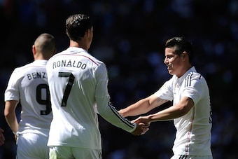 MADRID, SPAIN - APRIL 05:  Cristiano Ronaldo of Real Madrid CF celebrates with James Rodriguez after scoring his team's 4th goal during the La Liga match between Real Madrid CF and Granada CF at Estadio Santiago Bernabeu on April 5, 2015 in Madrid, Spain.