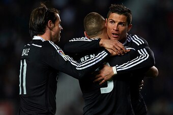 ELCHE, SPAIN - FEBRUARY 22:  Karim Benzema of Real Madrid celebrates after scoring with his teammates Cristiano Ronaldo (R) and Gareth Bale during the La Liga match between Elche FC and Real Madrid at Estadio Manuel Martinez Valero on February 22, 2015 in