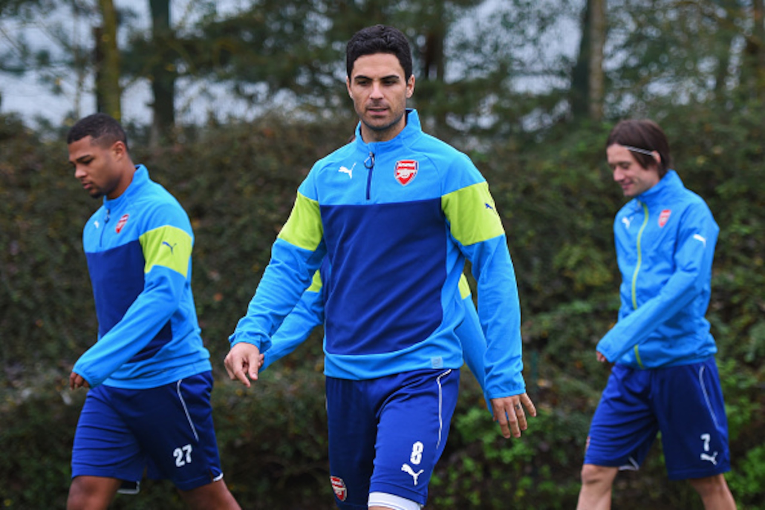 ST ALBANS, ENGLAND - NOVEMBER 03: (L-R) Serge Gnabry, Mikel Arteta and Tomas Rosicky look on during an Arsenal training session ahead of the UEFA Champions League match against RSC Anderlecht at London Colney on November 3, 2014 in St Albans, England. ( ST ALBANS, ENGLAND - NOVEMBER 03: (L-R) Serge Gnabry, Mikel Arteta and Tomas Rosicky look on during an Arsenal training session ahead of the UEFA Champions League match against RSC Anderlecht at London Colney on November 3, 2014 in St Albans, England. (