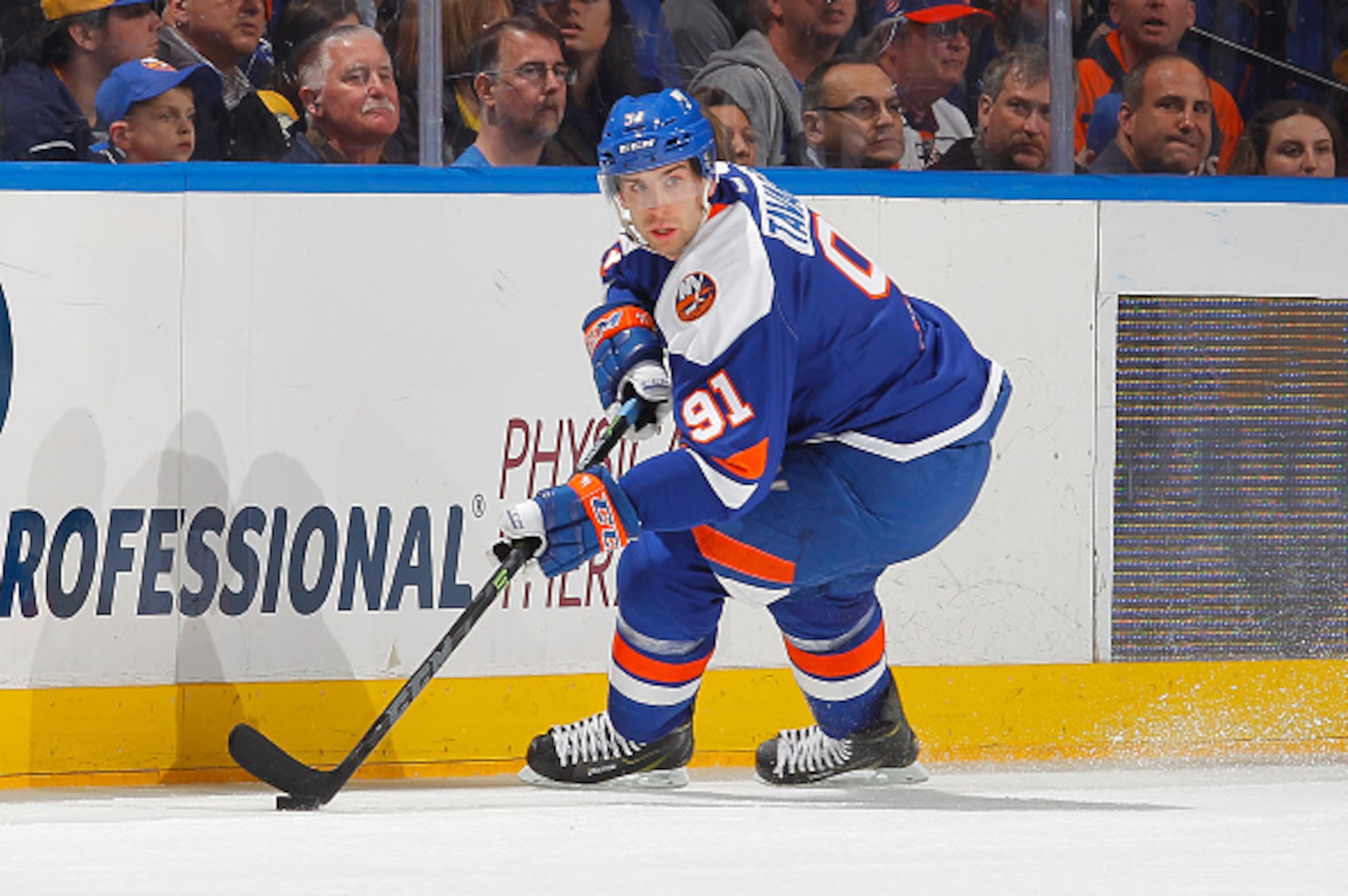 UNIONDALE, NY - APRIL 04:  John Tavares #91 of the New York Islanders in action against the Buffalo Sabres on April 4, 2015 at Nassau Veterans Memorial Coliseum in Uniondale, New York. The Islanders defeated the Sabres 3-0.  (Photo by Jim McIsaac/NHLI via