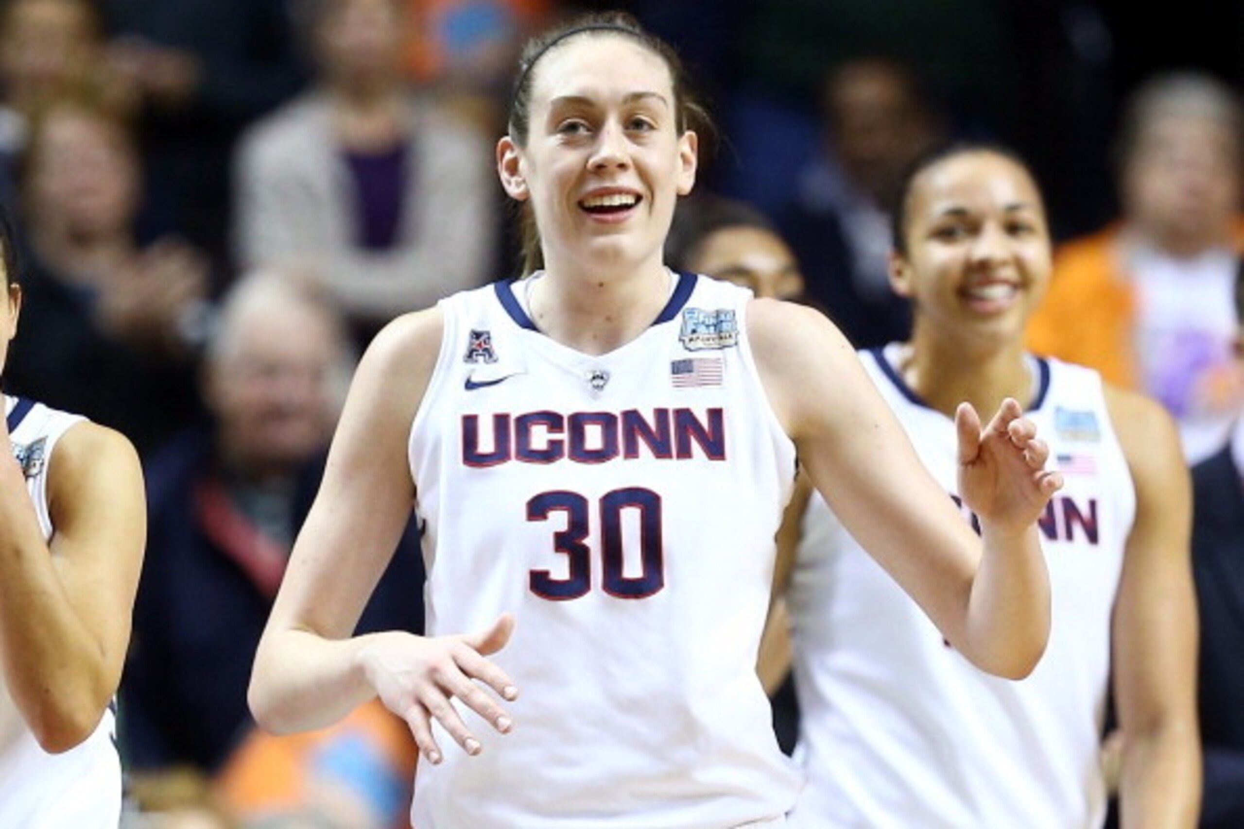 NASHVILLE, TN - APRIL 06:  Breanna Stewart #30 of the Connecticut Huskies smiles with teammates late in the game against the Stanford Cardinal during the NCAA Women's Final Four semifinal at Bridgestone Arena on April 6, 2014 in Nashville, Tennessee.  (Ph