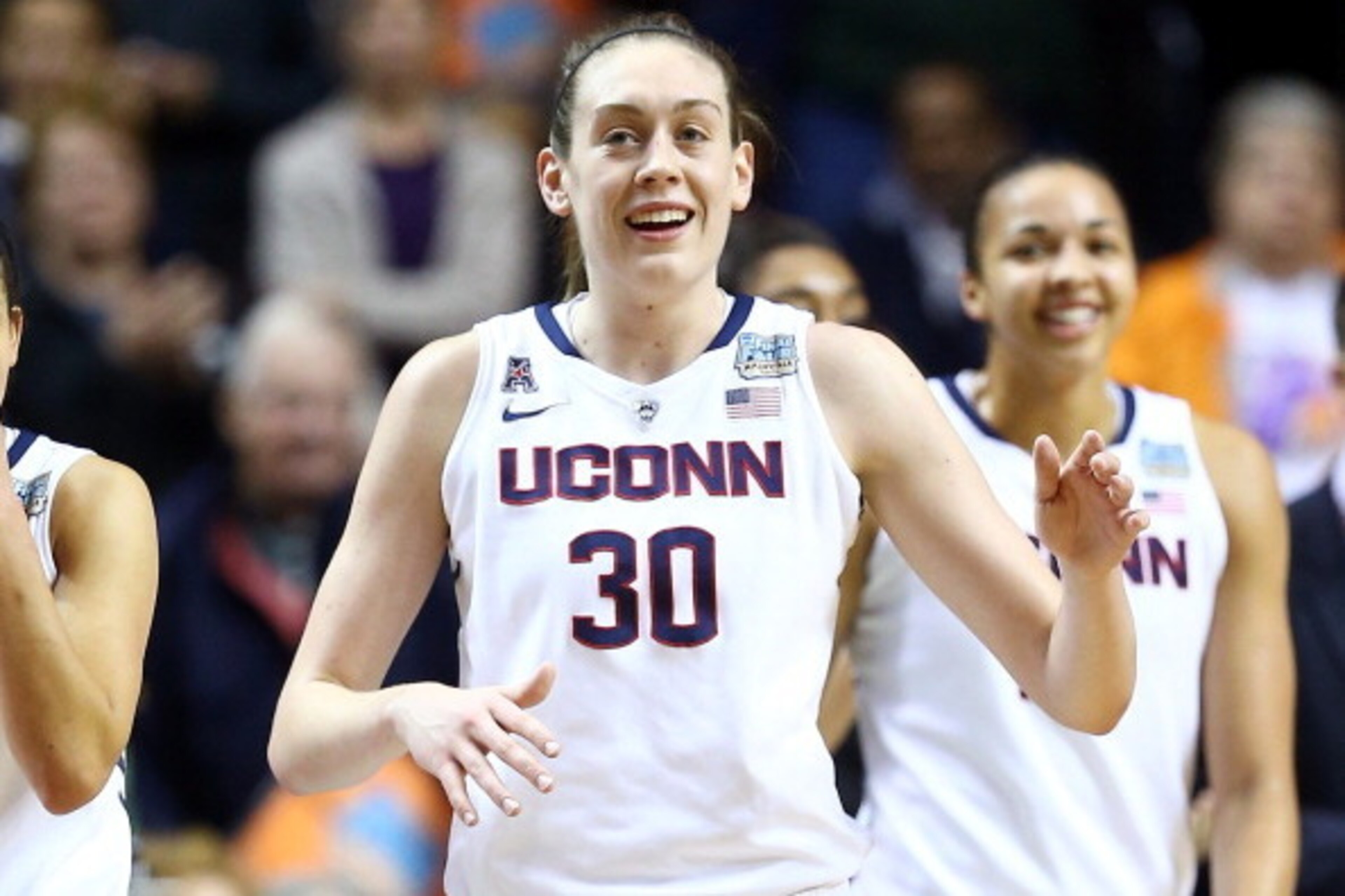 NASHVILLE, TN - APRIL 06:  Breanna Stewart #30 of the Connecticut Huskies smiles with teammates late in the game against the Stanford Cardinal during the NCAA Women's Final Four semifinal at Bridgestone Arena on April 6, 2014 in Nashville, Tennessee.  (Ph