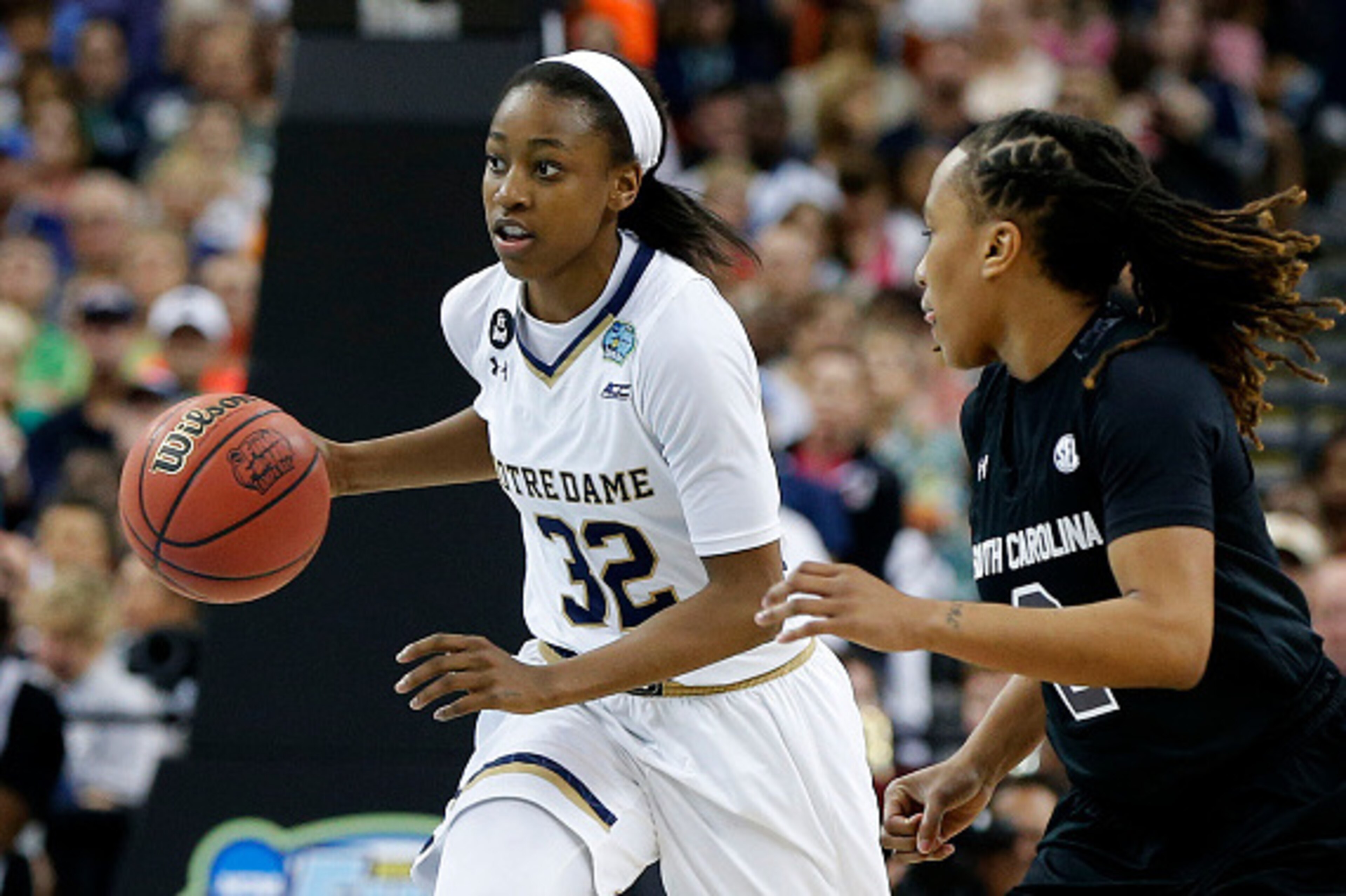 TAMPA, FL - APRIL 05:  Jewell Loyd #32 of the Notre Dame Fighting Irish drives against Olivia Gaines #2 of the South Carolina Gamecocks in the second half during the NCAA Women's Final Four Semifinal at Amalie Arena on April 5, 2015 in Tampa, Florida.  (P