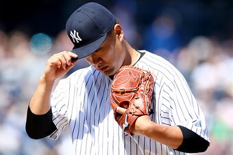 NEW YORK, NY - APRIL 06:  Masahiro Tanaka #19 of the New York Yankees walks off the field after the first inning against the Toronto Blue Jays during Opening Day on April 6, 2015 at Yankee Stadium in the Bronx borough of New York City.  (Photo by Elsa/Get