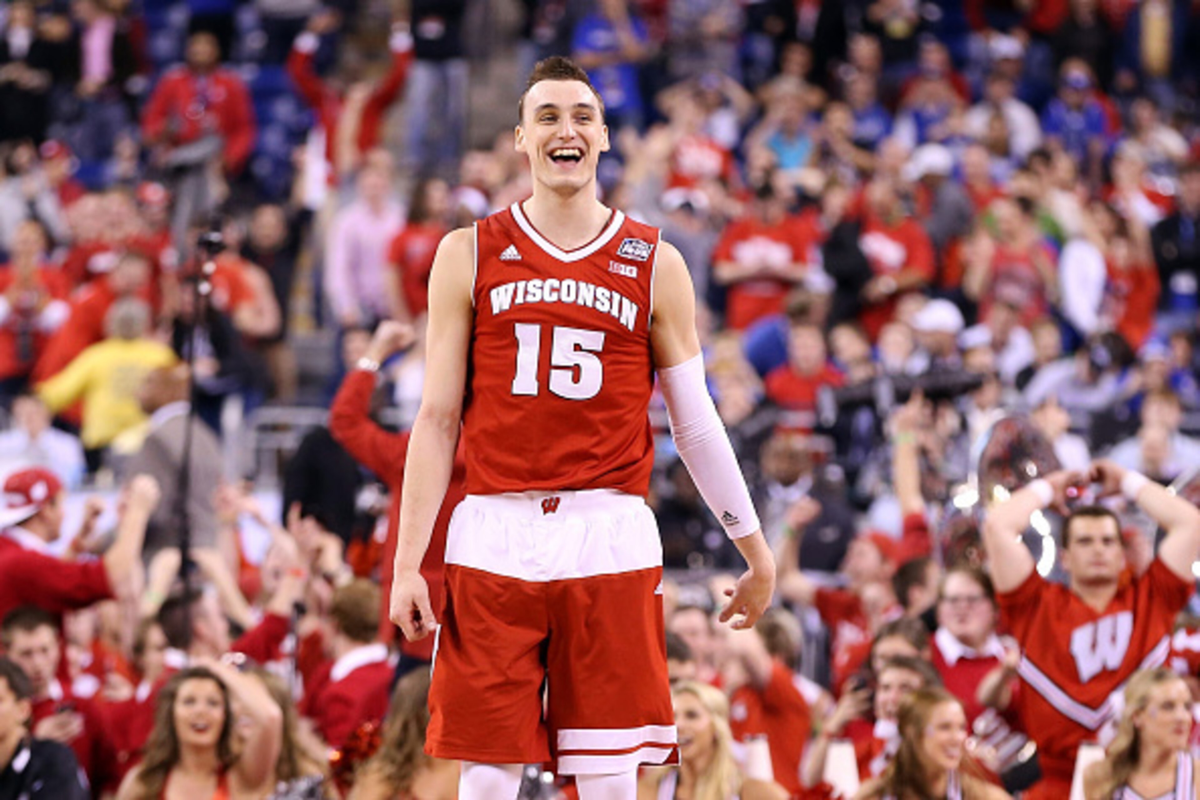 INDIANAPOLIS, IN - APRIL 04:  Sam Dekker #15 of the Wisconsin Badgers reacts late in the game against the Kentucky Wildcats during the NCAA Men's Final Four Semifinal at Lucas Oil Stadium on April 4, 2015 in Indianapolis, Indiana.  (Photo by Andy Lyons/Ge