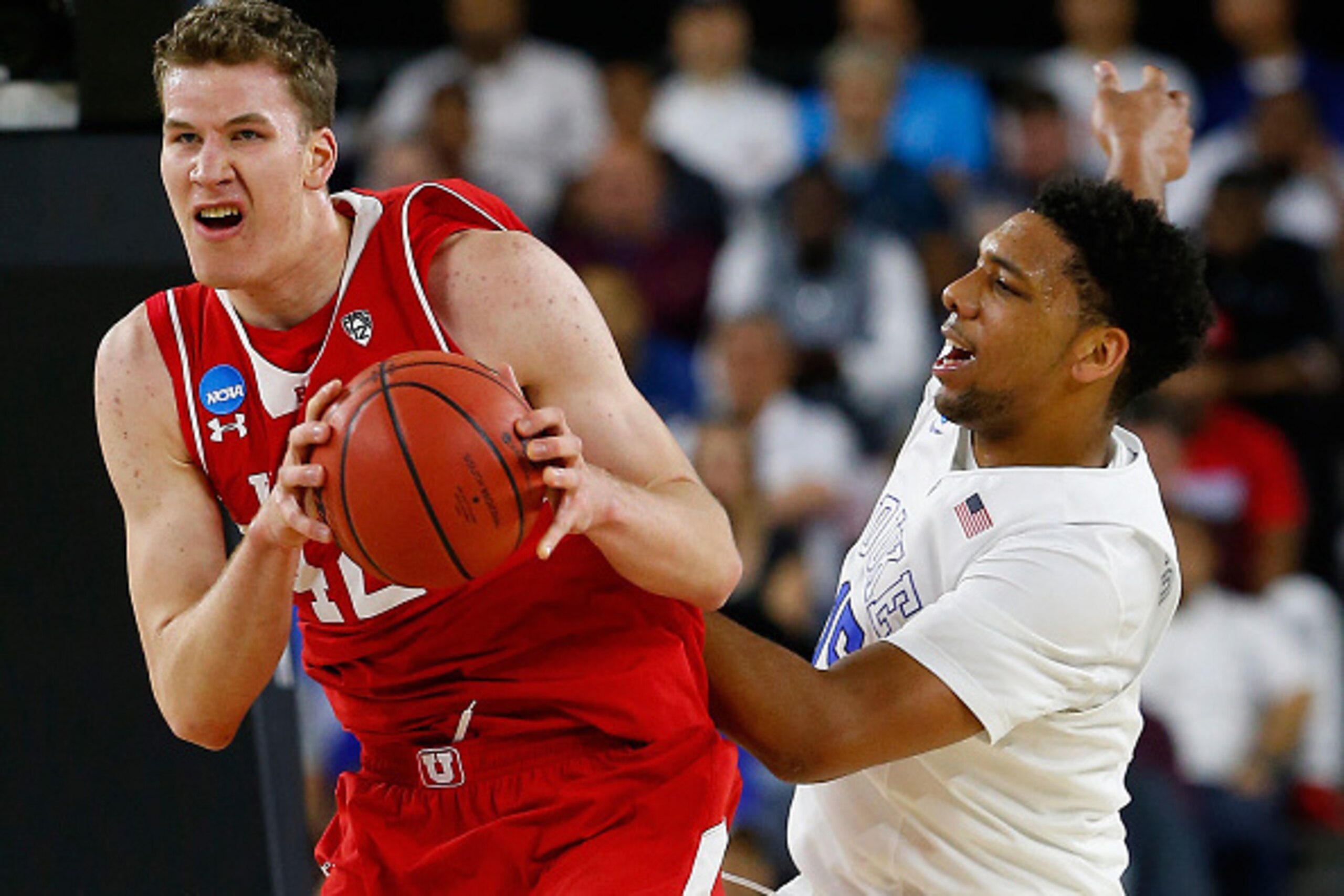 HOUSTON, TX - MARCH 27: Jakob Poeltl #42 of the Utah Utes and Jahlil Okafor #15 of the Duke Blue Devils battle for a rebound in the first half during a South Regional Semifinal game of the 2015 NCAA Men's Basketball Tournament at NRG Stadium on March 27, 