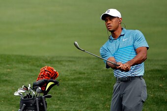AUGUSTA, GA - APRIL 06:  Tiger Woods of the United States hits a chip shot on the practice range during a practice round prior to the start of the 2015 Masters Tournament at Augusta National Golf Club on April 6, 2015 in Augusta, Georgia.  (Photo by Ezra 