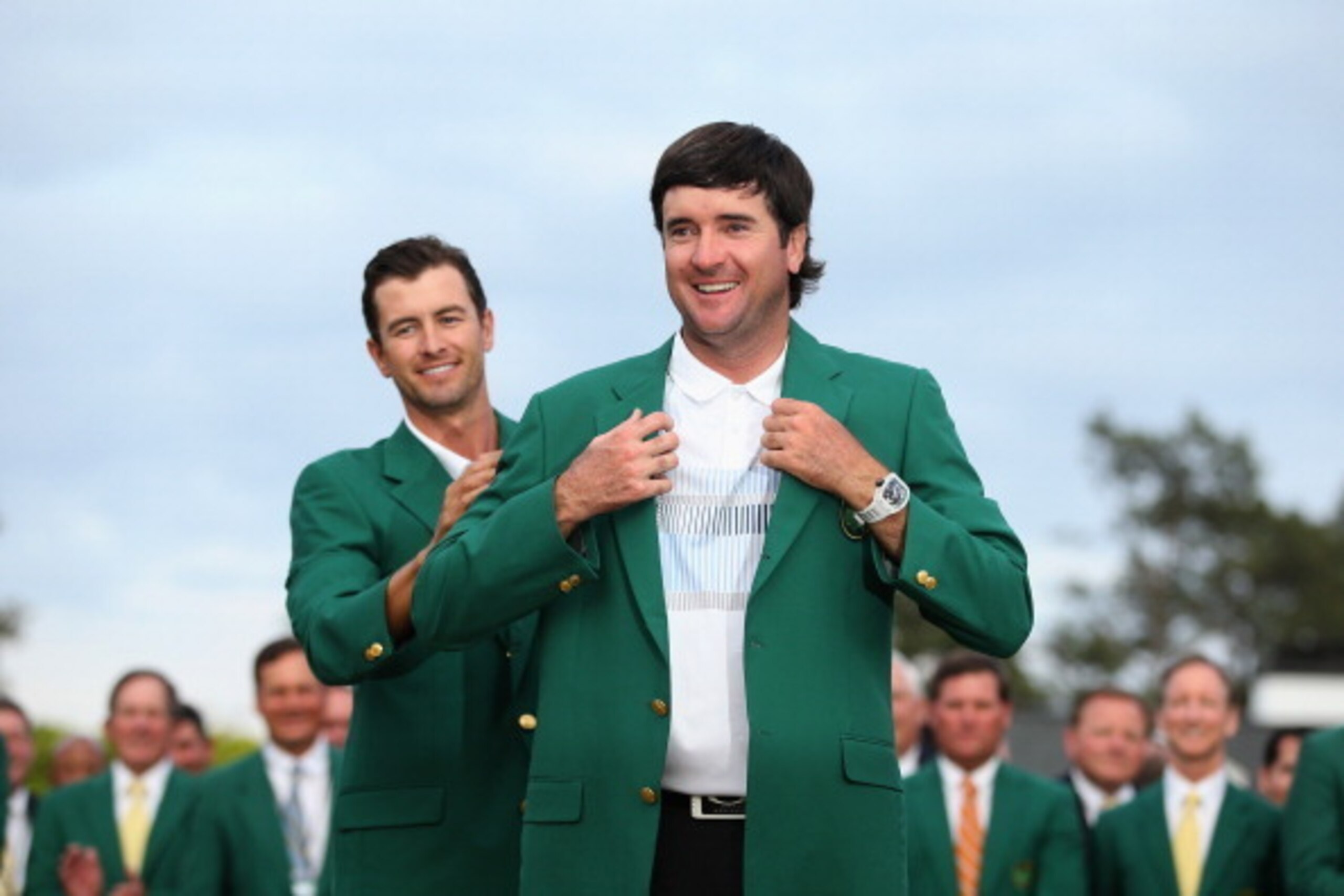 AUGUSTA, GA - APRIL 13: Adam Scott of Australia presents Bubba Watson of the United States with the green jacket after Watson won the 2014 Masters Tournament by a three-stroke margin at Augusta National Golf Club on April 13, 2014 in Augusta, Georgia. ( AUGUSTA, GA - APRIL 13: Adam Scott of Australia presents Bubba Watson of the United States with the green jacket after Watson won the 2014 Masters Tournament by a three-stroke margin at Augusta National Golf Club on April 13, 2014 in Augusta, Georgia. (