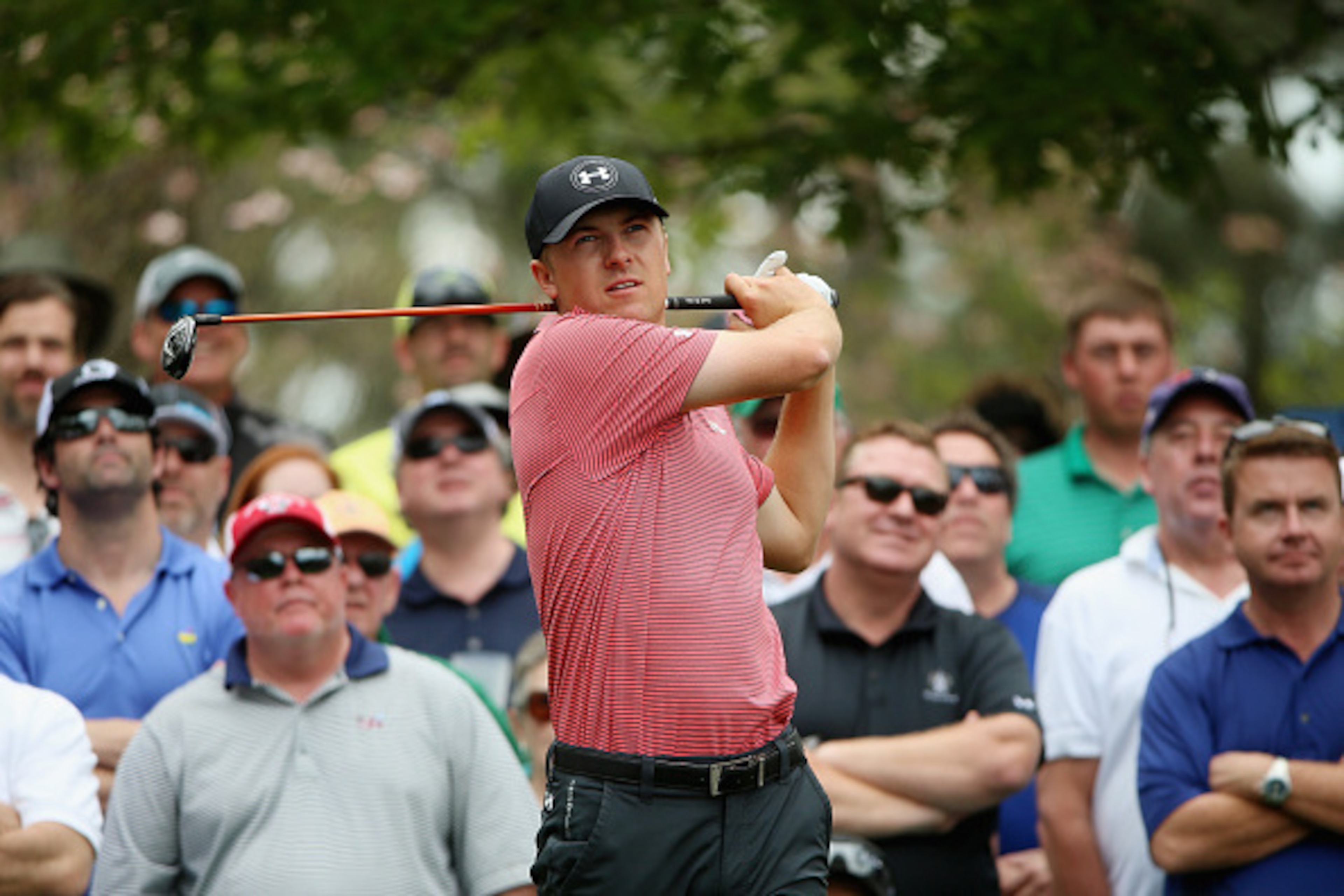 AUGUSTA, GA - APRIL 06:  Jordan Spieth of the United States hits a shot as a gallery of fans look on during a practice round prior to the start of the 2015 Masters Tournament at Augusta National Golf Club on April 6, 2015 in Augusta, Georgia.  (Photo by A