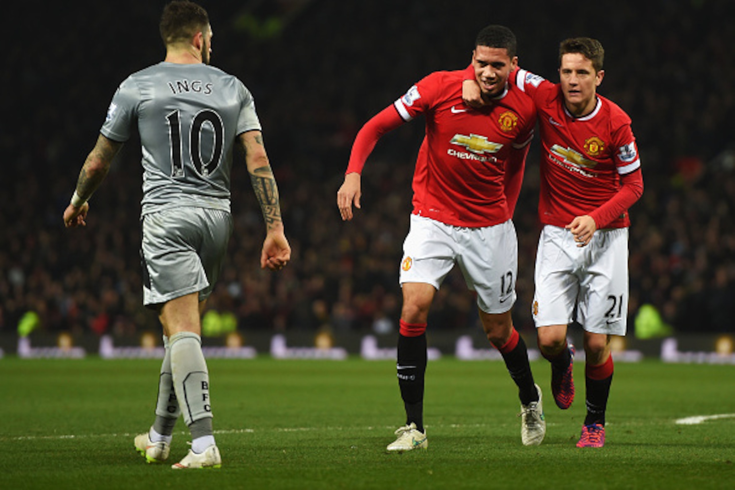 MANCHESTER, ENGLAND - FEBRUARY 11:  Chris Smalling of Manchester United celebrates scoring his second goal with Ander Herrera of Manchester United during the Barclays Premier League match between Manchester United and Burnley at Old Trafford on February 1