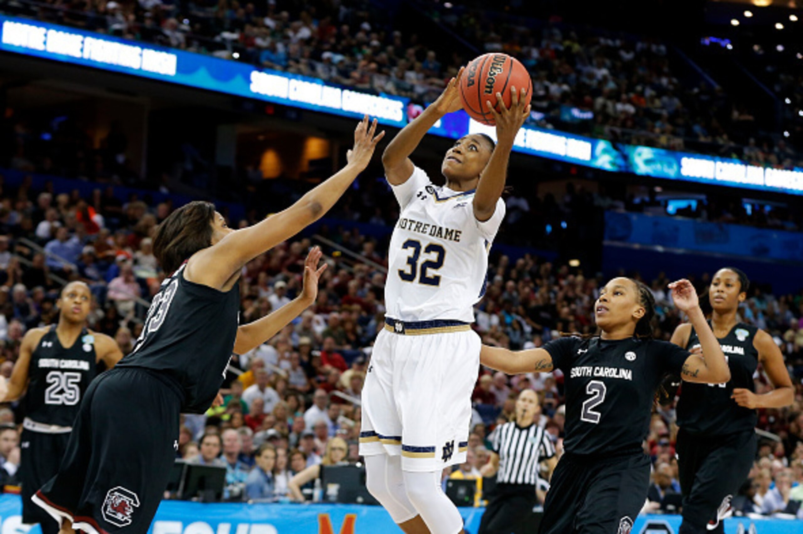 TAMPA, FL - APRIL 05:  Jewell Loyd #32 of the Notre Dame Fighting Irish shoots against Tina Roy #23 of the South Carolina Gamecocks in the second half during the NCAA Women's Final Four Semifinal at Amalie Arena on April 5, 2015 in Tampa, Florida.  (Photo