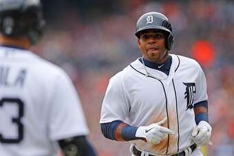 DETROIT, MI - APRIL 6: Yoenis Cespedes #52 of the Detroit Tigers scores during the sixth inning on the Nick Castellanos (not in photo) sacrifice fly during the Opening Day game against the Minnesota Twins at Comerica Park on April 6, 2015 in Detroit, Mich
