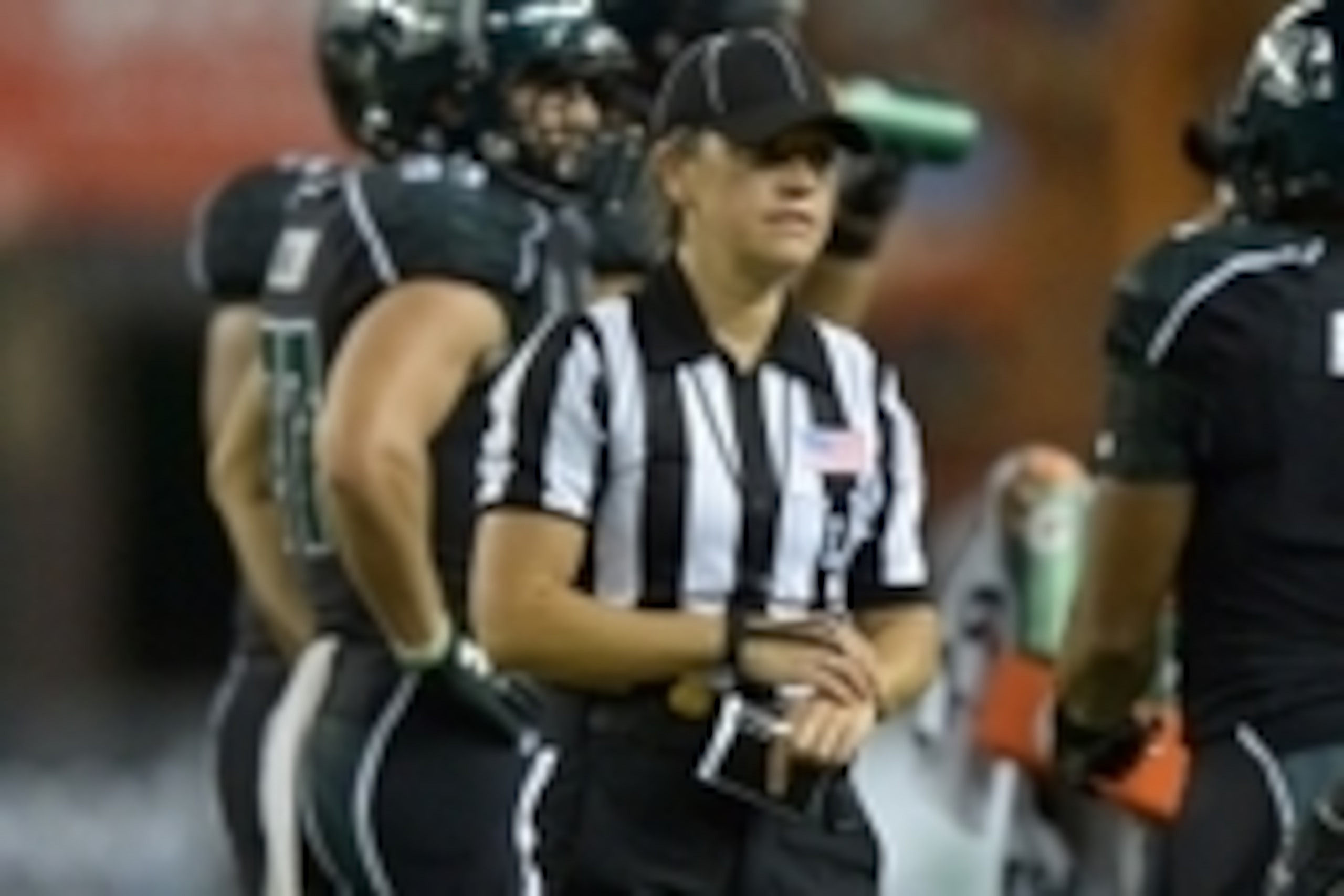 Aug 29, 2013; Honolulu, HI, USA; Line judge referee Catherine Conti during the NCAA football game between the Southern California Trojans and the Hawaii Rainbow Warriors at Aloha Stadium. Mandatory Credit: Kirby Lee-USA TODAY Sports Aug 29, 2013; Honolulu, HI, USA; Line judge referee Catherine Conti during the NCAA football game between the Southern California Trojans and the Hawaii Rainbow Warriors at Aloha Stadium. Mandatory Credit: Kirby Lee-USA TODAY Sports