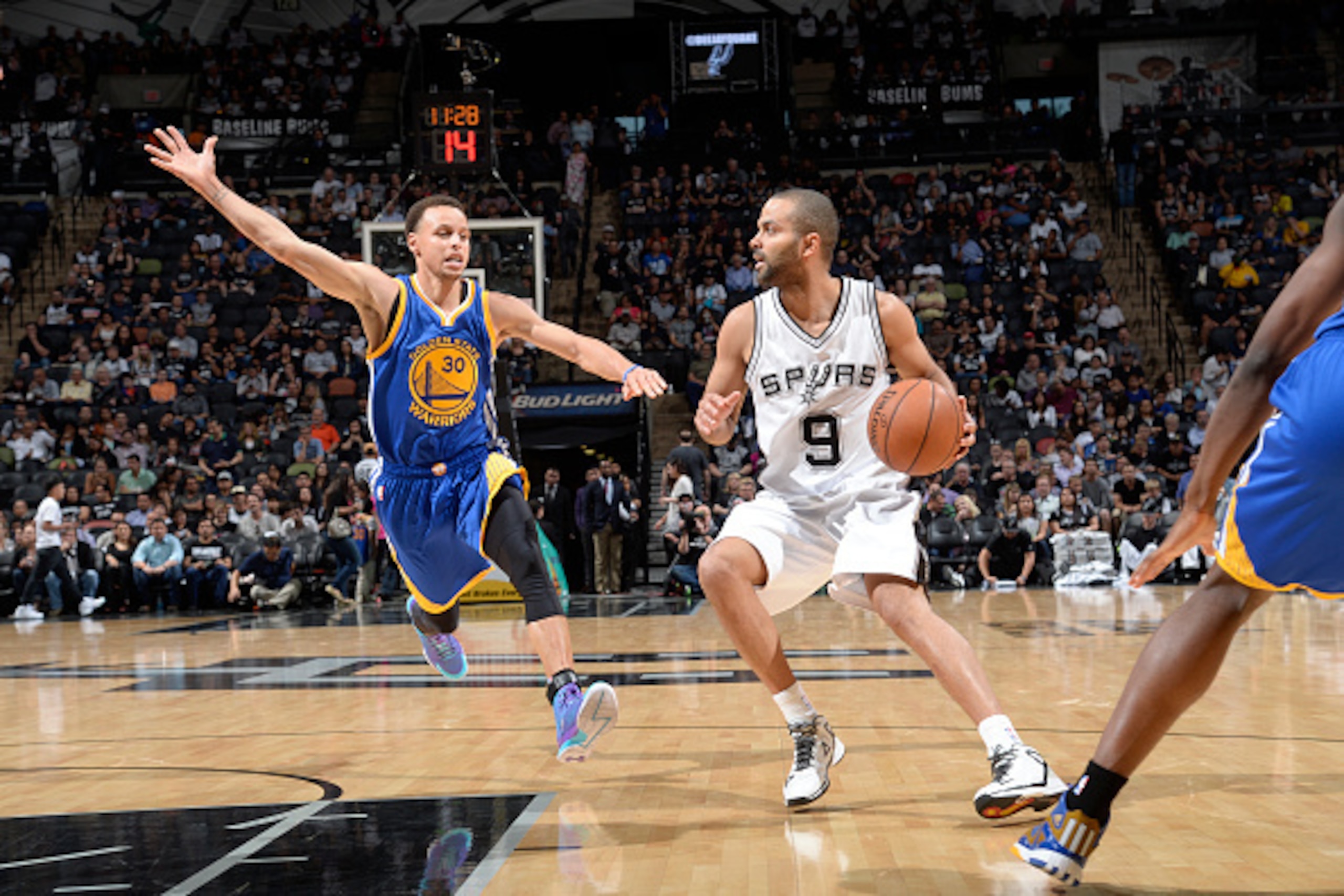 SAN ANTONIO, TX - APRIL 5: Tony Parker #9 of the San Antonio Spurs drives against Stephen Curry #30 of the Golden State Warriors on April 5, 2015 at the AT&T Center in San Antonio, Texas. NOTE TO USER: User expressly acknowledges and agrees that, by downl