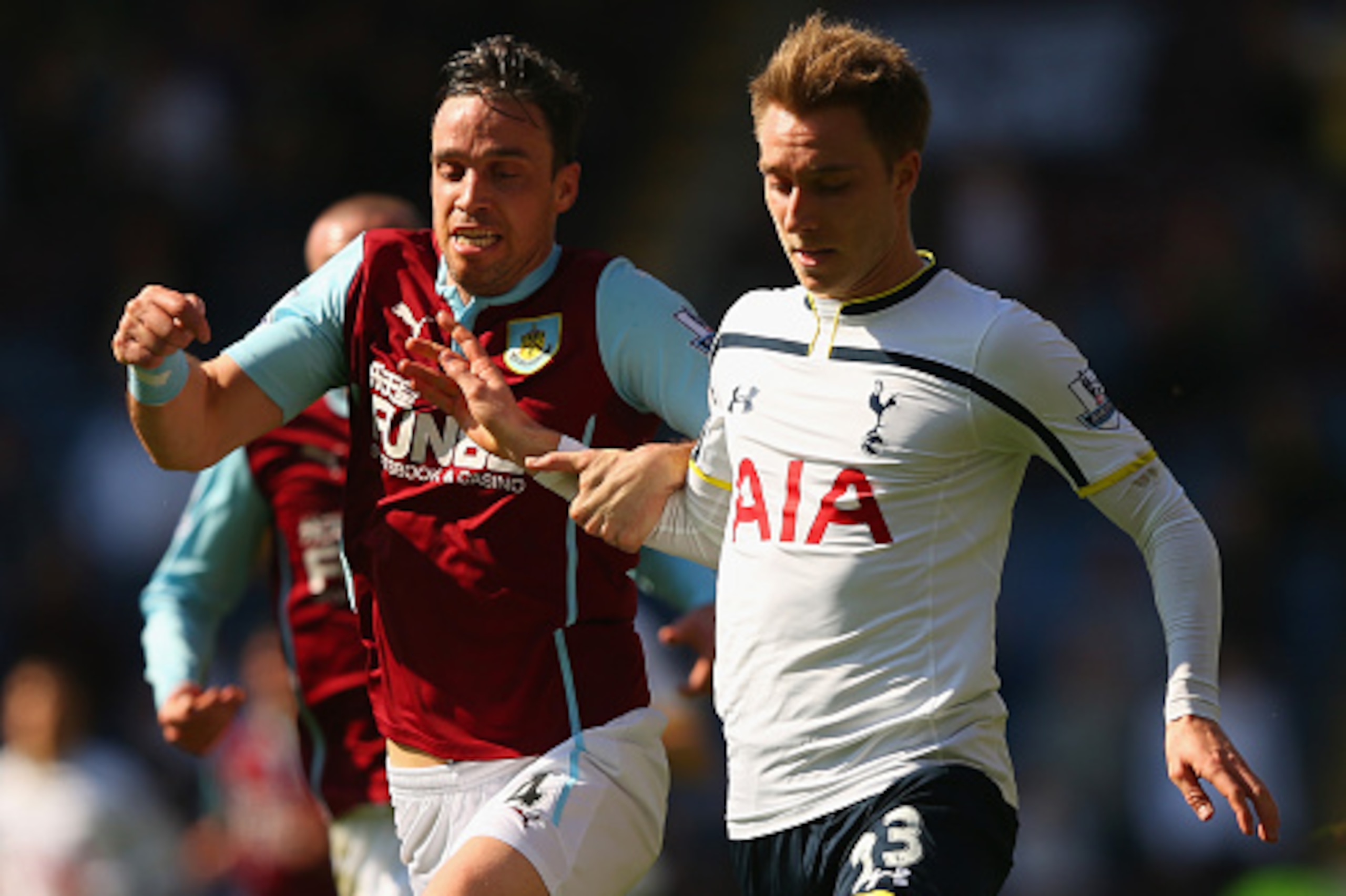BURNLEY, ENGLAND - APRIL 05: Michael Duff of Burnley and Christian Eriksen of Spurs battle for the ball during the Barclays Premier League match between Burnley and Tottenham Hotspur at Turf Moor on April 5, 2015 in Burnley, England.  (Photo by Alex Lives