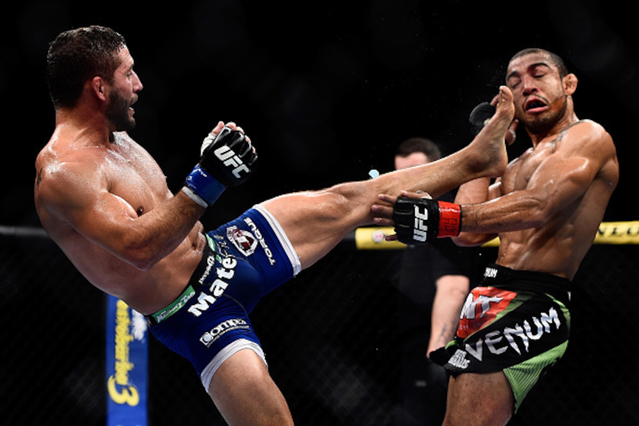 RIO DE JANEIRO, BRAZIL - OCTOBER 25: Chad Mendes of the United States kicks Jose Aldo of Brazil in their featherweight championship bout during the UFC 179 event at Maracanazinho on October 25, 2014 in Rio de Janeiro, Brazil. (Photo by Buda Mendes/Getty I
