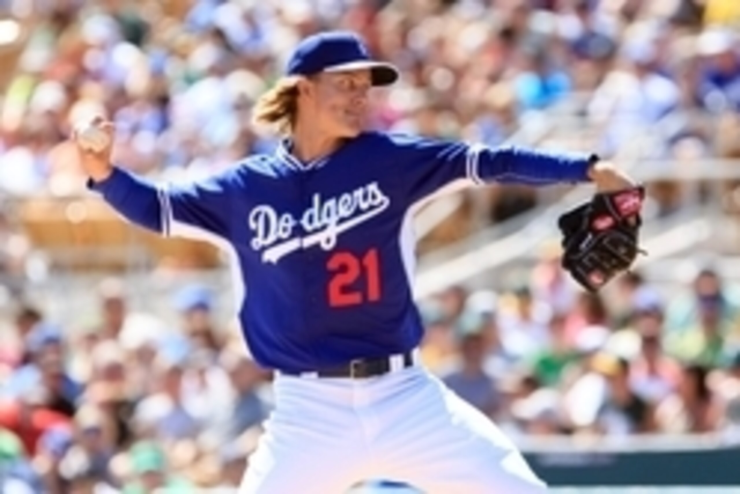 Mar 16, 2015; Phoenix, AZ, USA; Los Angeles Dodgers pitcher Zack Greinke (21) on the mound in the third inning during a spring training game against the Oakland Athletics at Camelback Ranch. Mandatory Credit: Allan Henry-USA TODAY Sports