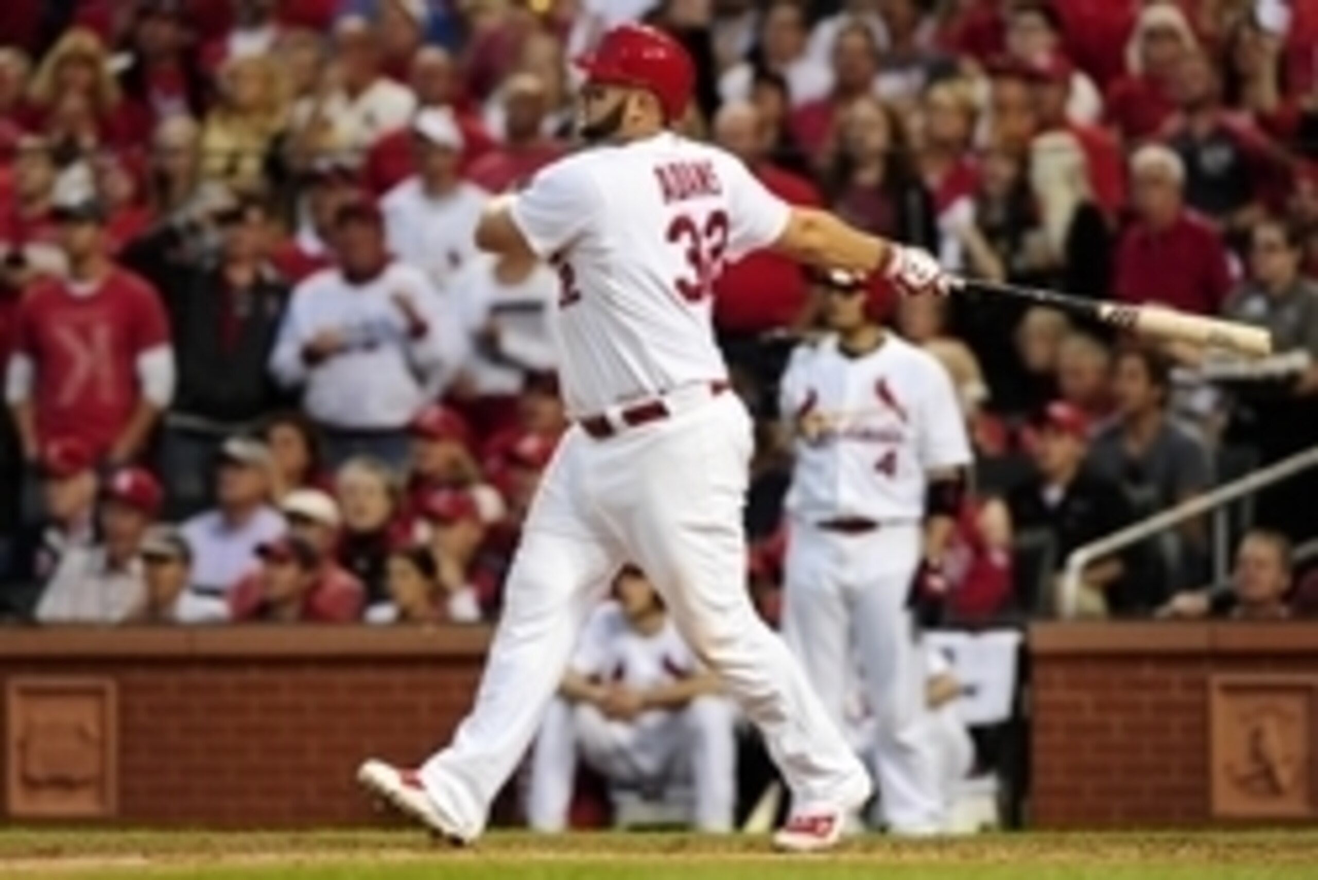 Oct 7, 2014; St. Louis, MO, USA; St. Louis Cardinals first baseman Matt Adams (32) hits a three-run home run against the Los Angeles Dodgers in the 7th inning during game four of the 2014 NLDS baseball playoff game at Busch Stadium. Mandatory Credit: Jeff