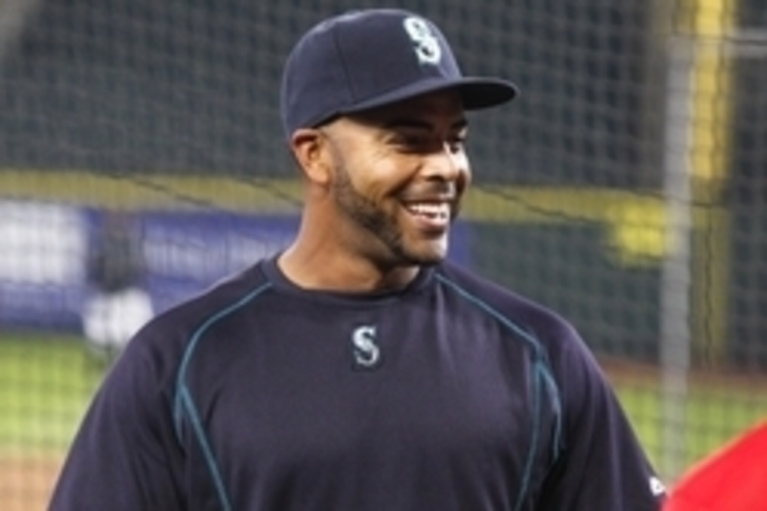 Apr 6, 2015; Seattle, WA, USA; Seattle Mariners designated hitter Nelson Cruz (23) talks with a member of the Los Angeles Angels during batting practice at Safeco Field. Mandatory Credit: Joe Nicholson-USA TODAY Sports
