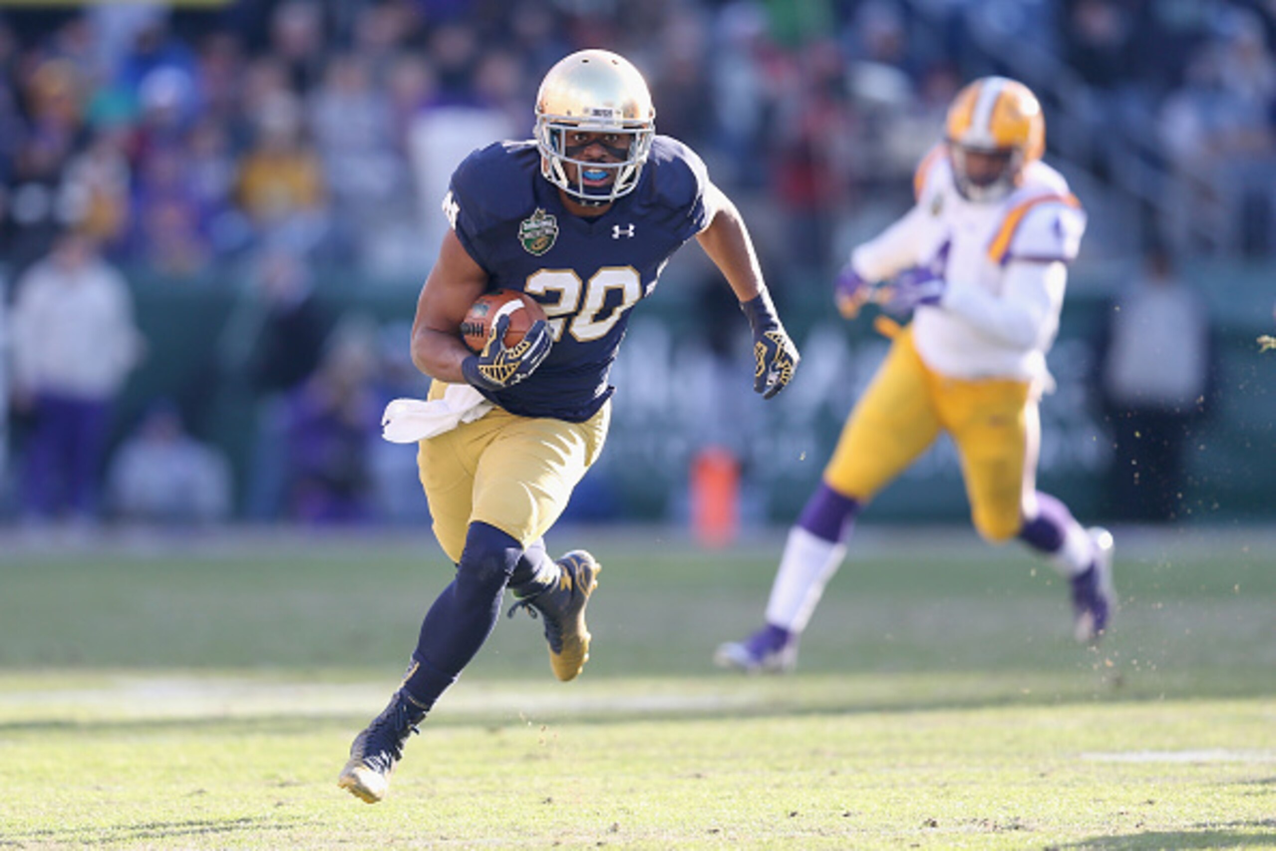 NASHVILLE, TN - DECEMBER 30: C.J. Prosise #20 of the Notre Dame Fighting Irish runs with the ball against the LSU Tigers during the Franklin American Mortgage Music City Bowl at LP Field on December 30, 2014 in Nashville, Tennessee. (Photo by Andy Lyon NASHVILLE, TN - DECEMBER 30: C.J. Prosise #20 of the Notre Dame Fighting Irish runs with the ball against the LSU Tigers during the Franklin American Mortgage Music City Bowl at LP Field on December 30, 2014 in Nashville, Tennessee. (Photo by Andy Lyon