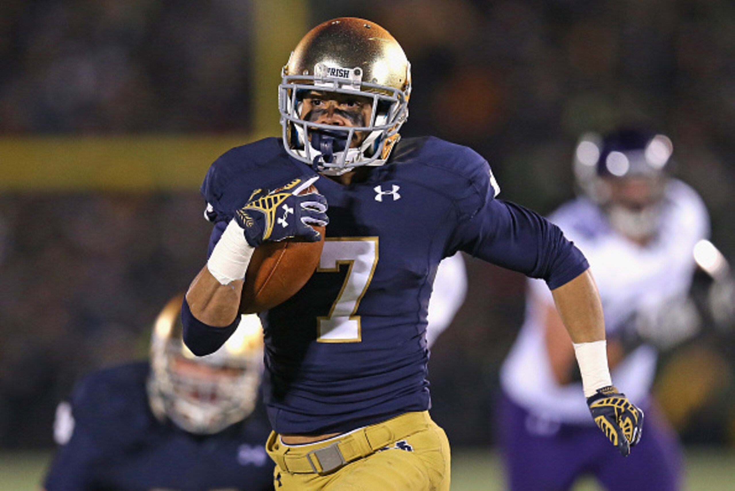 SOUTH BEND, IN - NOVEMBER 15: Will Fuller #7 of the Notre Dame Fighting Irish runs for a touchdown against the Northwestern Wildcats at Notre Dame Stadium on November 15, 2014 in South Bend, Indiana. Northwestern defeated Notre Dame 43-40 in overtime. (Ph SOUTH BEND, IN - NOVEMBER 15: Will Fuller #7 of the Notre Dame Fighting Irish runs for a touchdown against the Northwestern Wildcats at Notre Dame Stadium on November 15, 2014 in South Bend, Indiana. Northwestern defeated Notre Dame 43-40 in overtime. (Ph