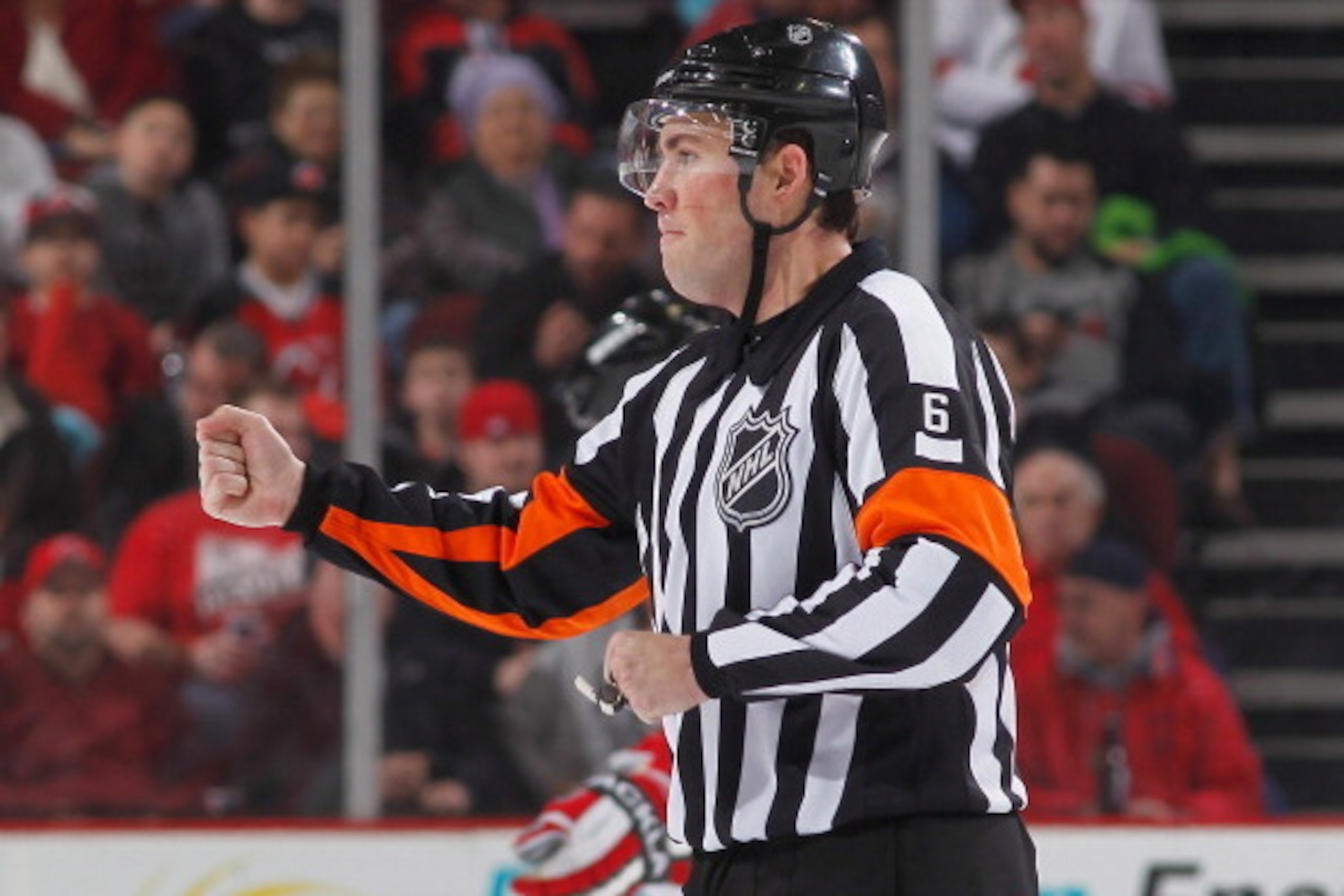 NEWARK, NJ - FEBRUARY 24:  Referee Francis Charron #6 calls a hooking penalty during the game between the Winnipeg Jets and the New Jersey Devils at the Prudential Center on February 24, 2013 in Newark, New Jersey.  (Photo by Andy Marlin/NHLI via Getty Im