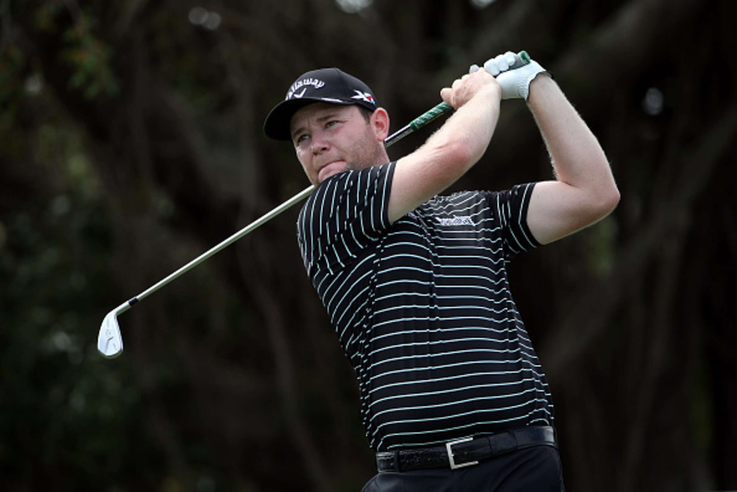 DORAL, FL - MARCH 05:  Branden Grace of South Africa plays a shot on the fifth hole during the first round of the World Golf Championships-Cadillac Championship at Trump National Doral Blue Monster Course on March 5, 2015 in Doral, Florida.  (Photo by Sam