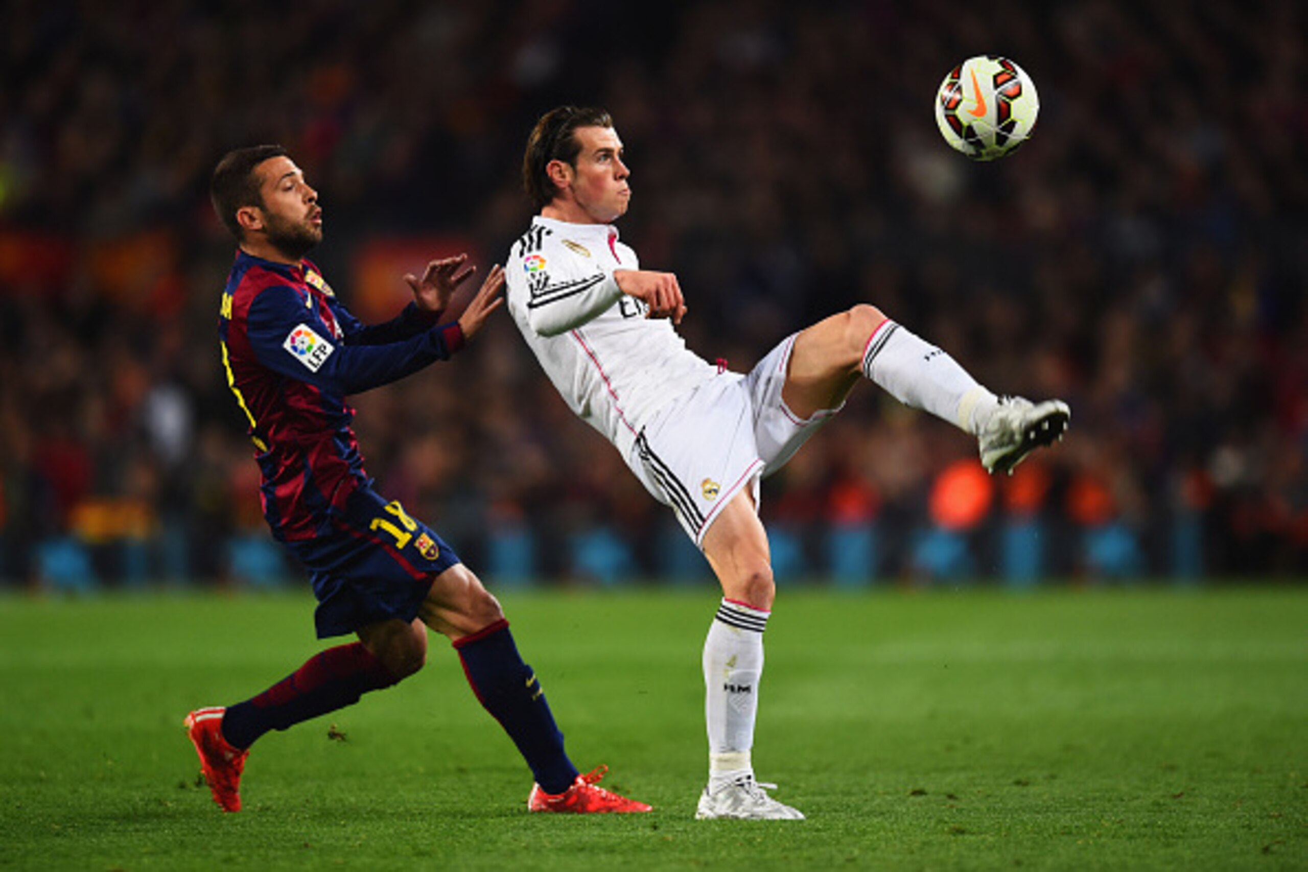 BARCELONA, SPAIN - MARCH 22:  Gareth Bale of Real Madrid CF controls the ball from Jordi Alba of Barcelona during the La Liga match between FC Barcelona and Real Madrid CF at Camp Nou on March 22, 2015 in Barcelona, Spain.  (Photo by Alex Caparros/Getty I