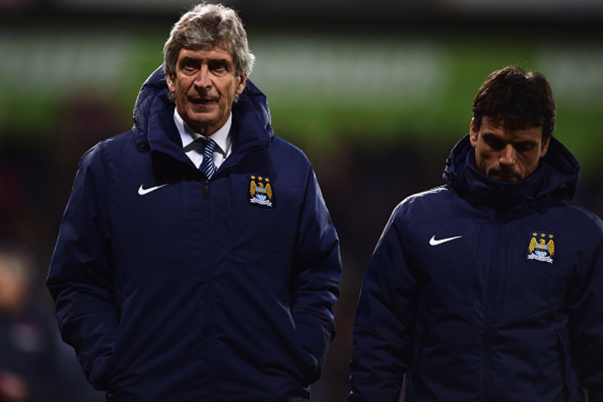 LONDON, ENGLAND - APRIL 06:  Manuel Pellegrini (L), manager of Manchester City looks dejected as he leaves the field after the Barclays Premier League match between Crystal Palace and Manchester City at Selhurst Park on April 6, 2015 in London, England.  