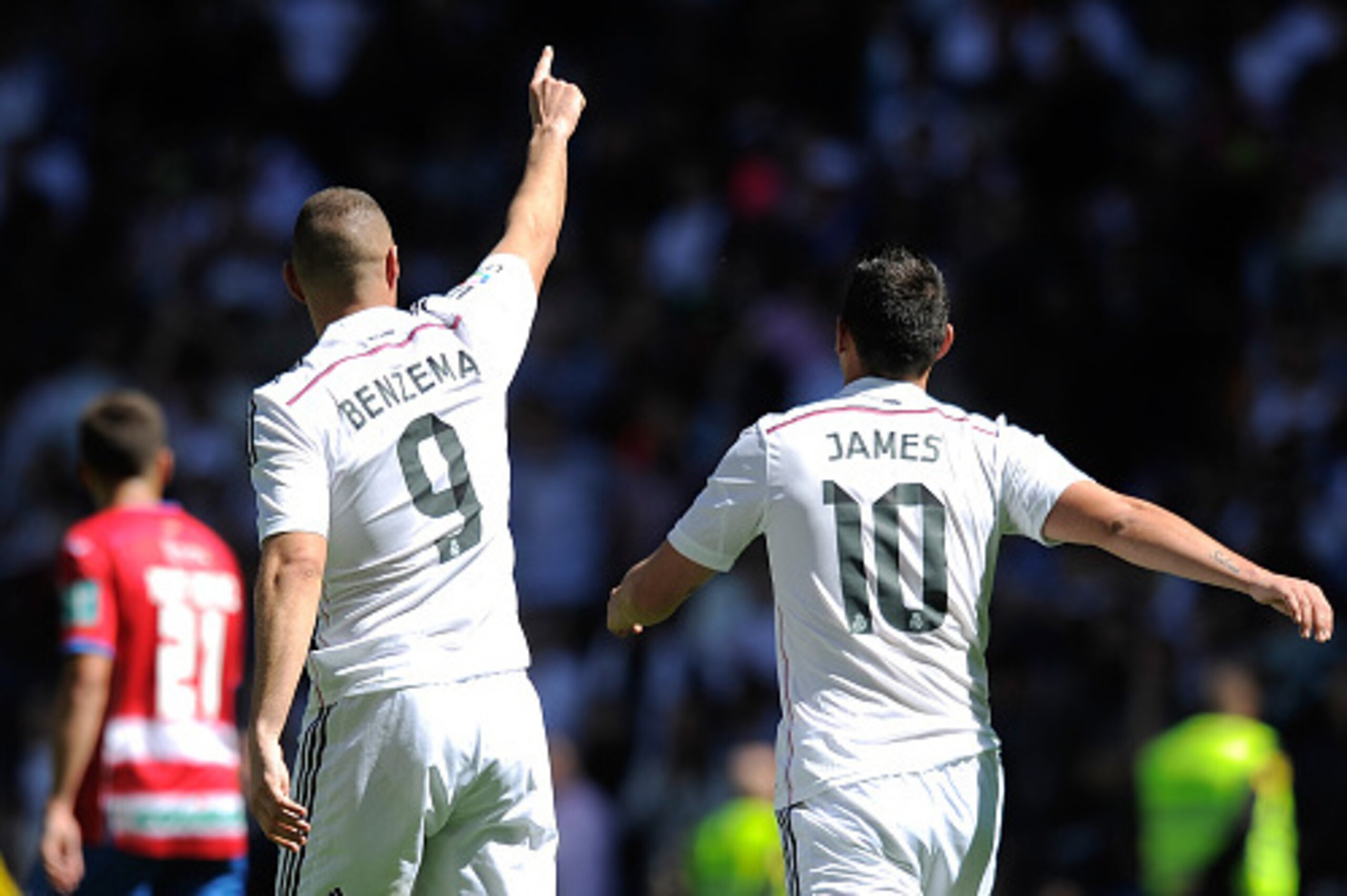 MADRID, SPAIN - APRIL 05:  Karim Benzema of Real Madrid CF celebrates with James Rodriguez after scoring his team's 7th goal during the La Liga match between Real Madrid CF and Granada CF at Estadio Santiago Bernabeu on April 5, 2015 in Madrid, Spain.  (P
