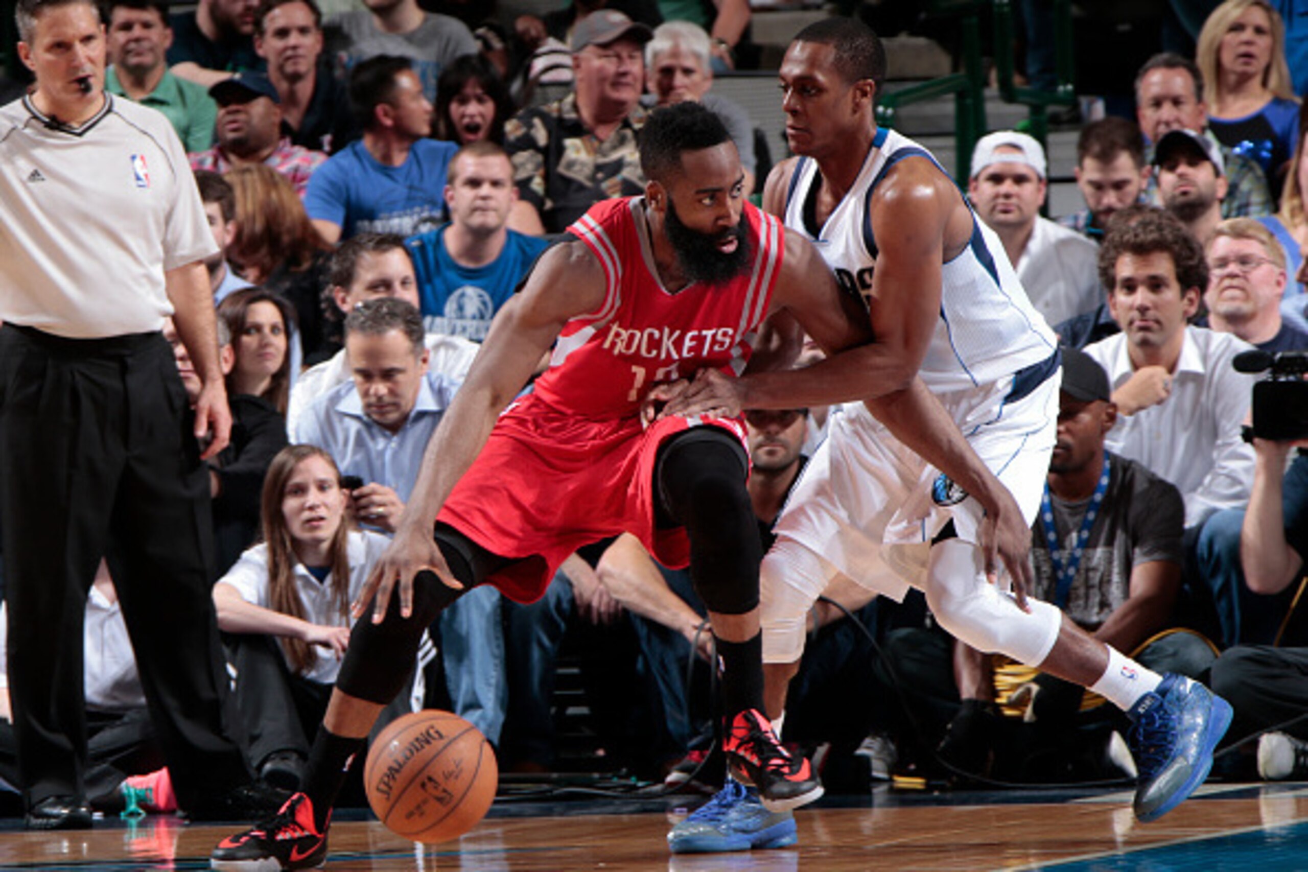 DALLAS, TX - APRIL 2: James Harden #13 of the Houston Rockets handles the ball against Rajon Rondo #9 of the Dallas Mavericks on April 2, 2015 at the American Airlines Center in Dallas, Texas. NOTE TO USER: User expressly acknowledges and agrees that, by 