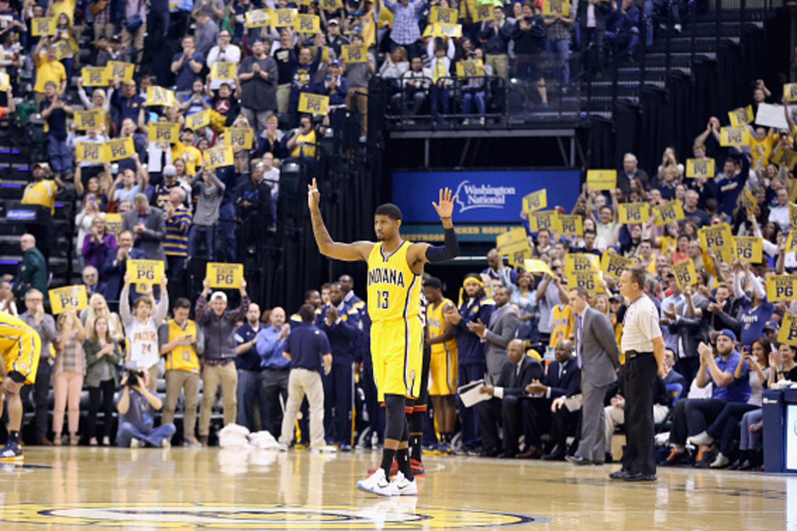INDIANAPOLIS, IN - APRIL 05:  Paul George #13 of the Indiana Pacers waves to the crowd as he walks onto the court for the first time in  the game against the Miami Heat at Bankers Life Fieldhouse on April 5, 2015 in Indianapolis, Indiana.  Tonight is his 