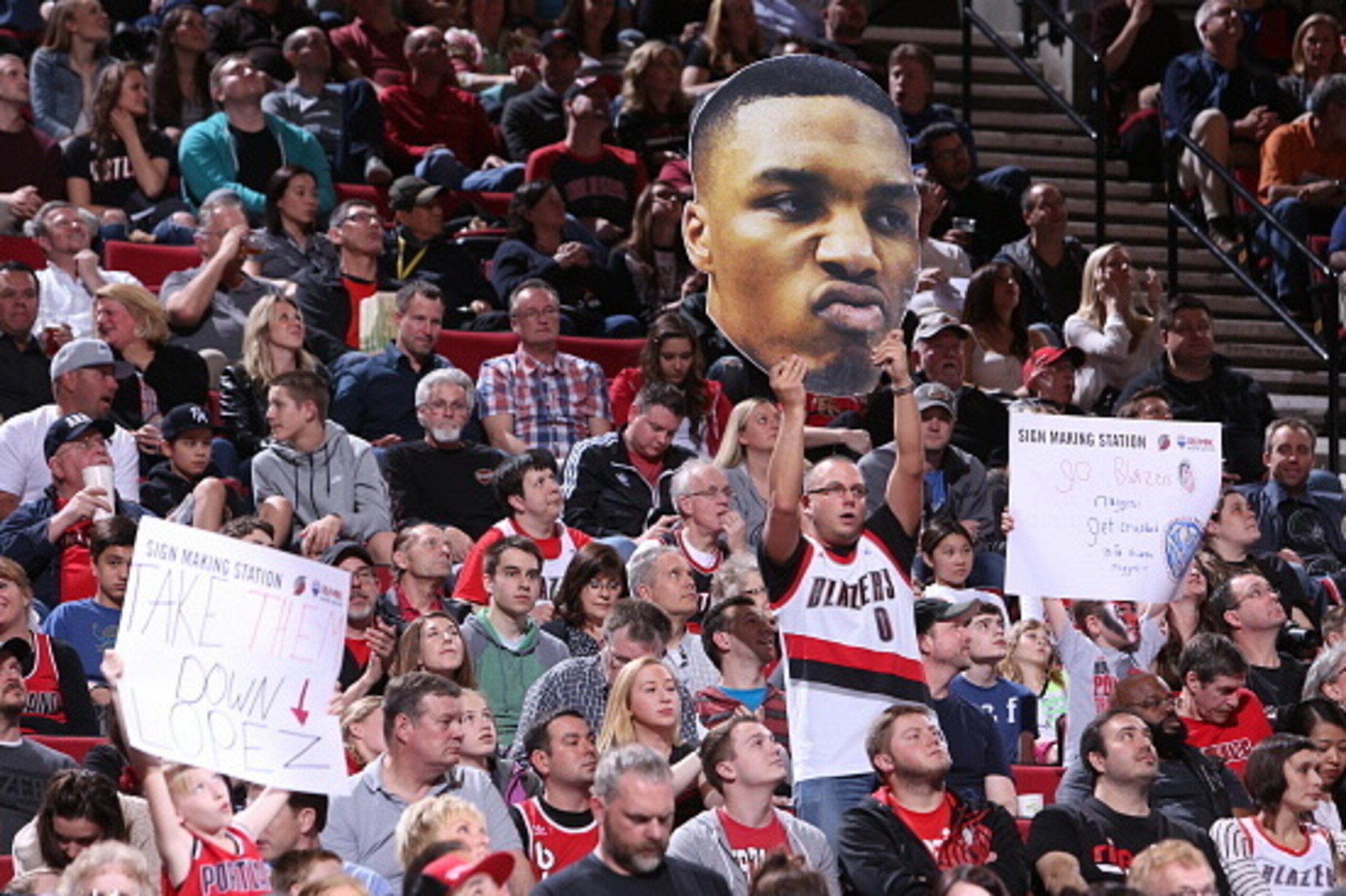 PORTLAND, OR - MARCH 28: A fan of Damian Lillard #0 of the Portland Trail Blazers holds a sign during a game against the Denver Nuggets on March 28, 2015 at the Moda Center Arena in Portland, Oregon. NOTE TO USER: User expressly acknowledges and agrees th