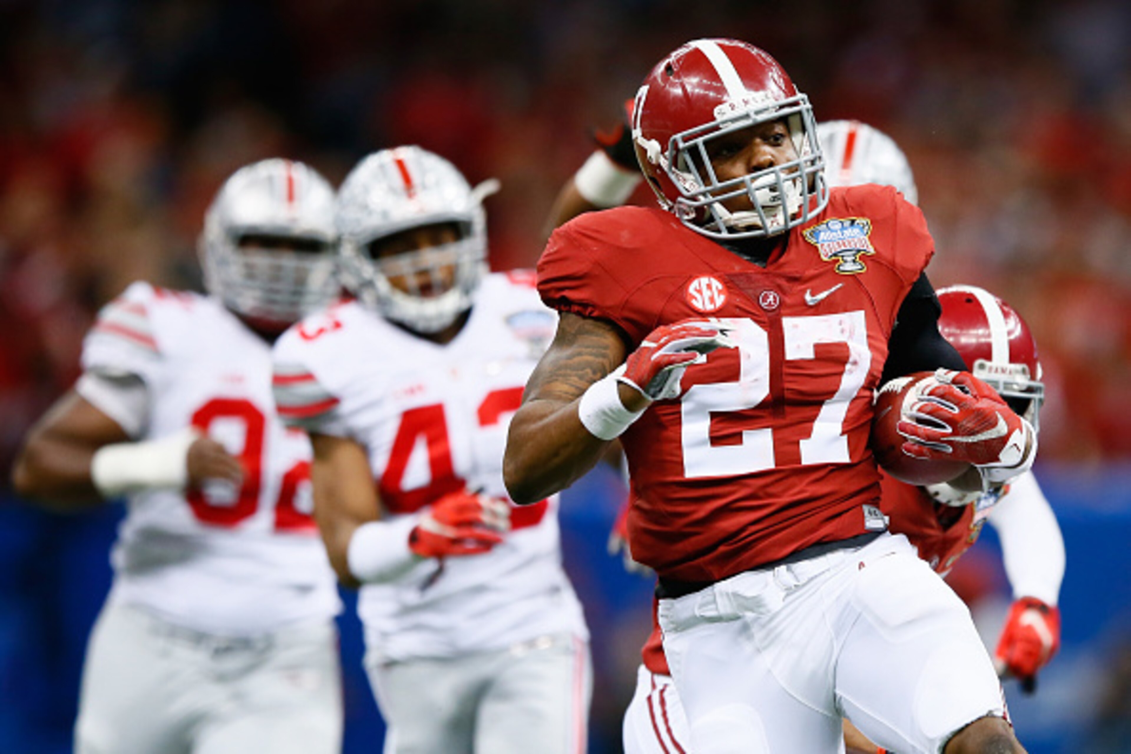 NEW ORLEANS, LA - JANUARY 01:  Derrick Henry #27 of the Alabama Crimson Tide runs the ball against the Ohio State Buckeyes during the All State Sugar Bowl at the Mercedes-Benz Superdome on January 1, 2015 in New Orleans, Louisiana.  (Photo by Kevin C. Cox