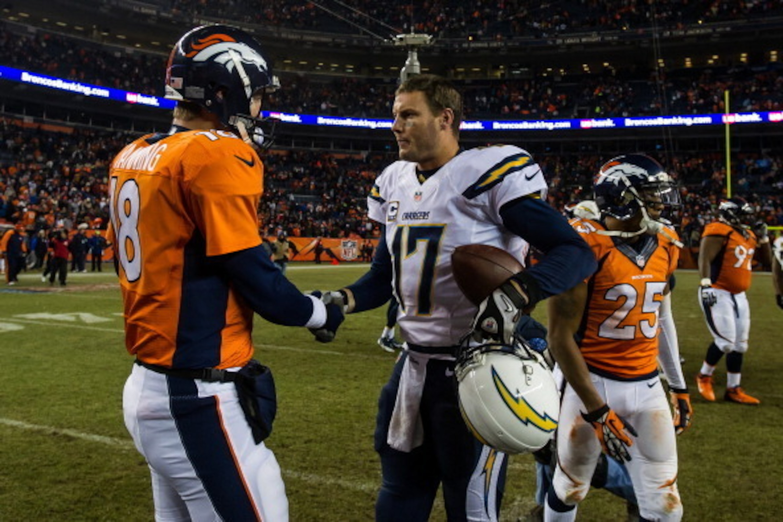 DENVER, CO - DECEMBER 12:  Quarterback Peyton Manning #18 of the Denver Broncos congratulates quarterback Philip Rivers #17 of the San Diego Chargers after a 27-20 loss to the San Diego Chargers at Sports Authority Field Field at Mile High on December 12,