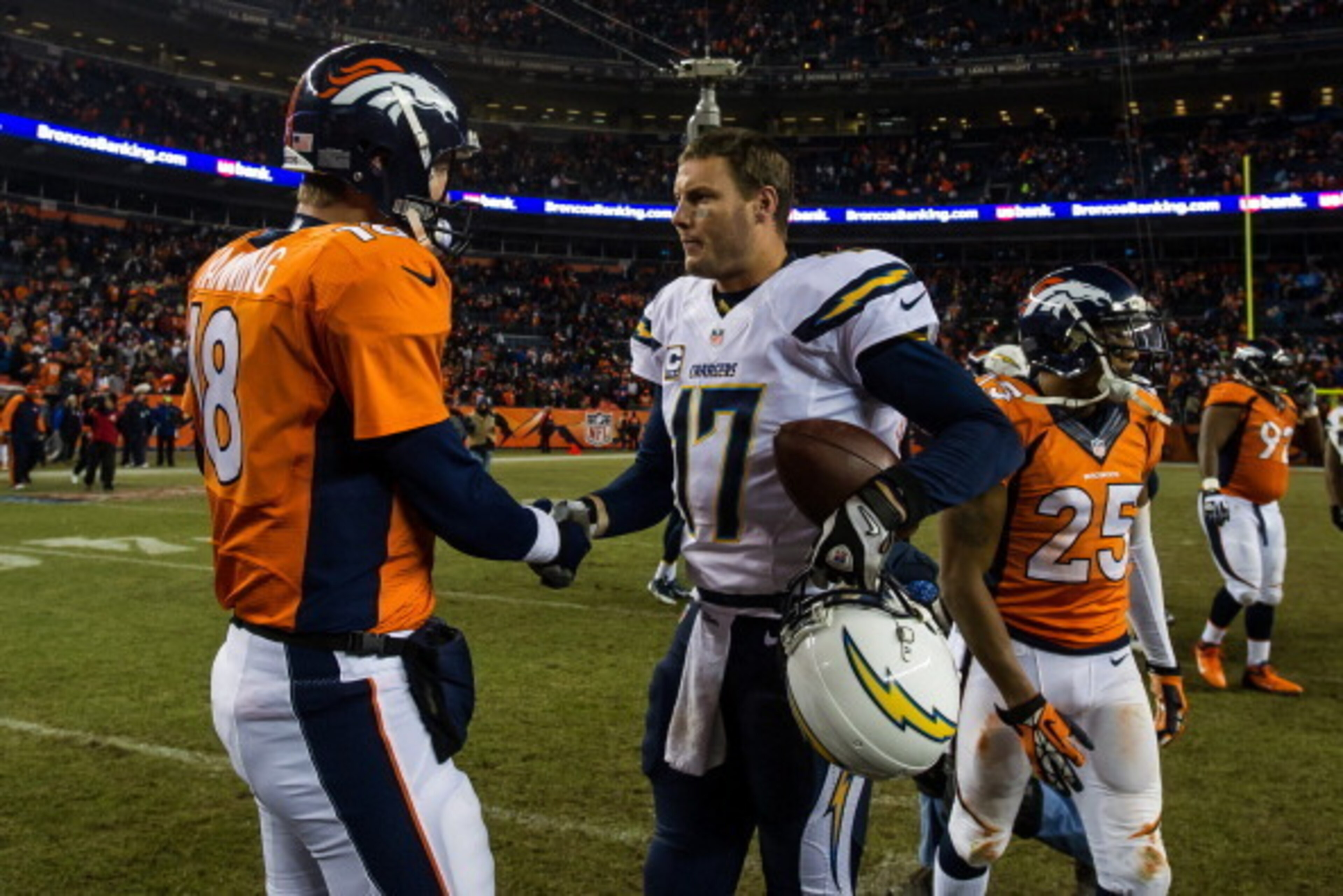 DENVER, CO - DECEMBER 12:  Quarterback Peyton Manning #18 of the Denver Broncos congratulates quarterback Philip Rivers #17 of the San Diego Chargers after a 27-20 loss to the San Diego Chargers at Sports Authority Field Field at Mile High on December 12,