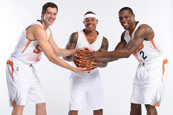 PHOENIX, AZ - SEPTEMBER 29: Goran Dragic #1,  Isaiah Thomas #3 and Eric Bledsoe #2 of the Phoenix Suns pose for a photo during Phoenix Suns Media Day on September 29, 2014 at U.S. Airways Center in Phoenix, Arizona. NOTE TO USER: User expressly acknowledg