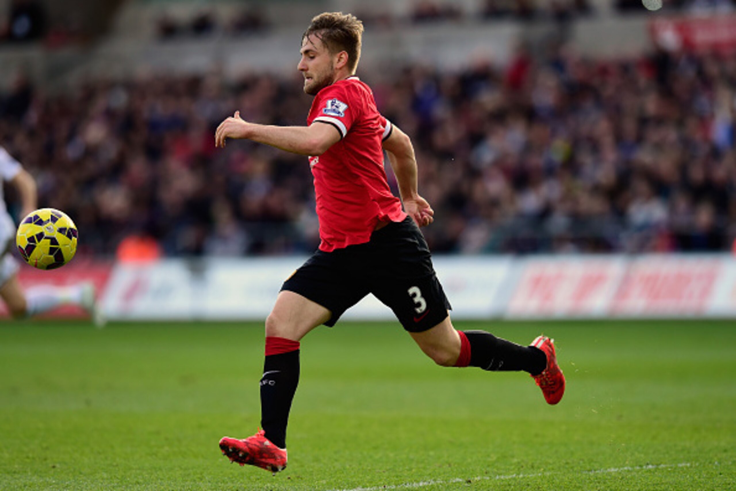 SWANSEA, WALES - FEBRUARY 21: Luke Shaw of Manchester United in action during the Barclays Premier League match between Swansea City and Manchester United at Liberty Stadium on February 21, 2015 in Swansea, Wales.  (Photo by Stu Forster/Getty Images)