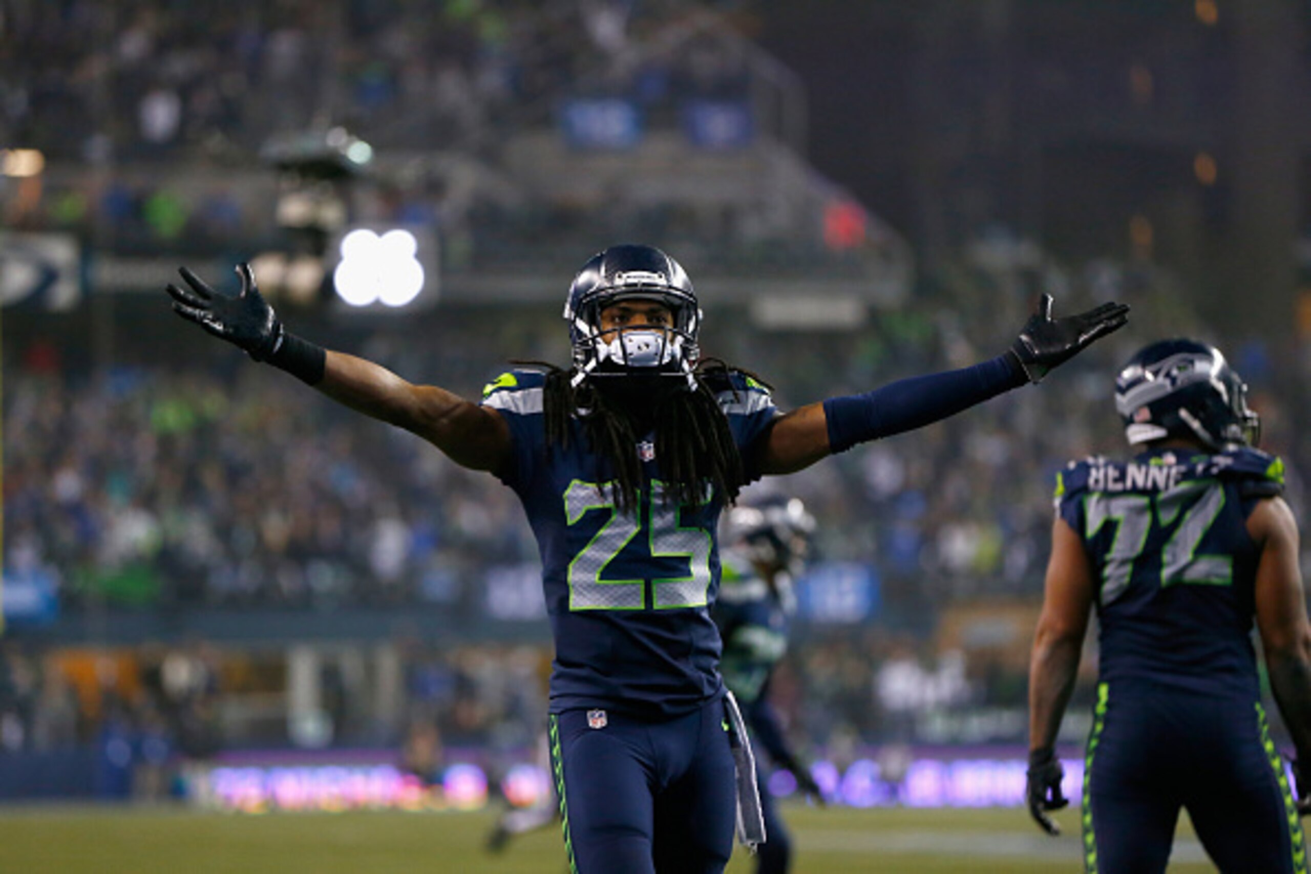 SEATTLE, WA - JANUARY 10:   Richard Sherman #25 of the Seattle Seahawks reacts after a play against the Carolina Panthers during the 2015 NFC Divisional Playoff game at CenturyLink Field on January 10, 2015 in Seattle, Washington.  (Photo by Jonathan Ferr