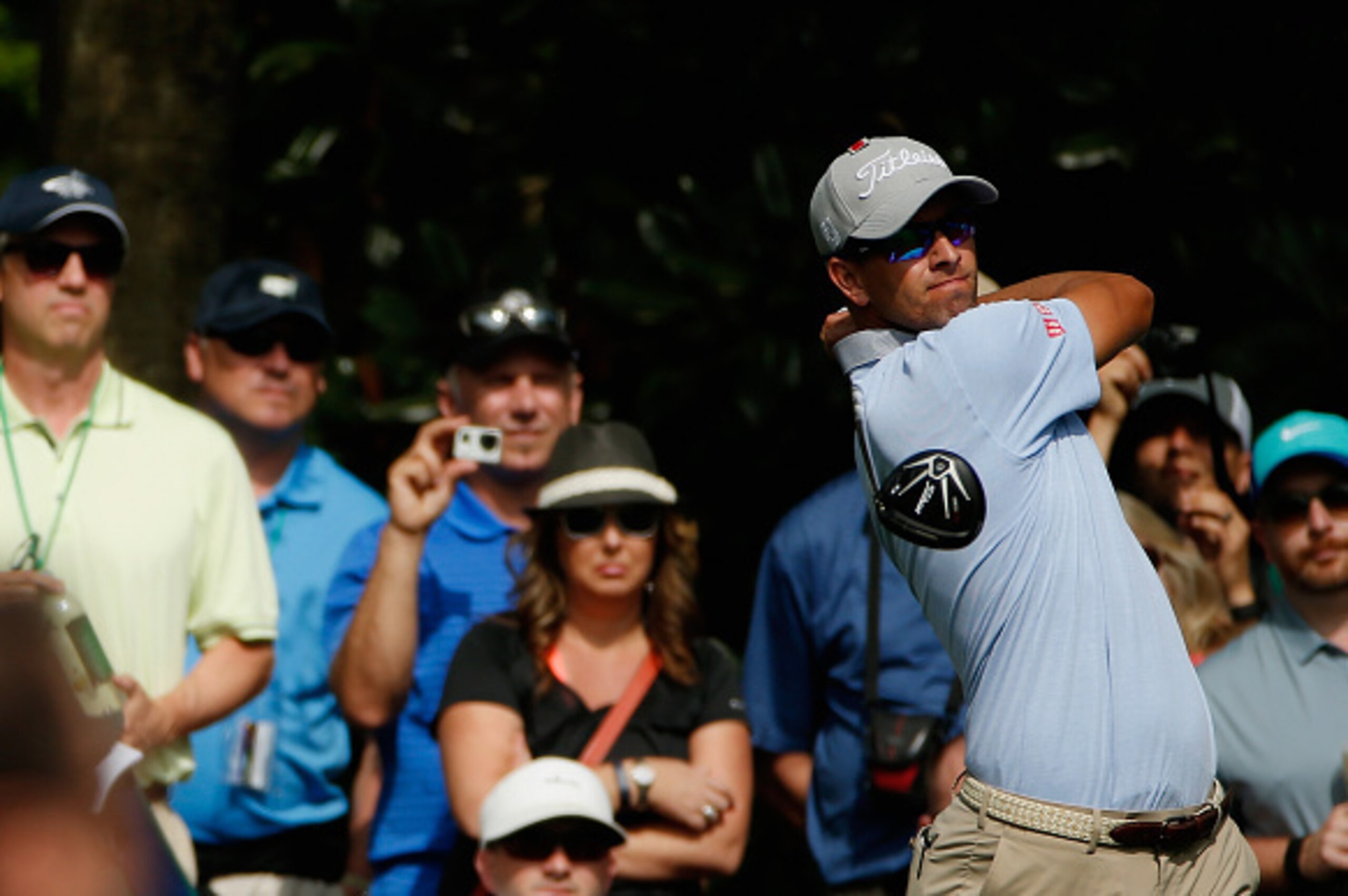 AUGUSTA, GA - APRIL 06:  Adam Scott of Australia hits a tee shot as a gallery of fans look on during a practice round prior to the start of the 2015 Masters Tournament at Augusta National Golf Club on April 6, 2015 in Augusta, Georgia.  (Photo by Ezra Sha