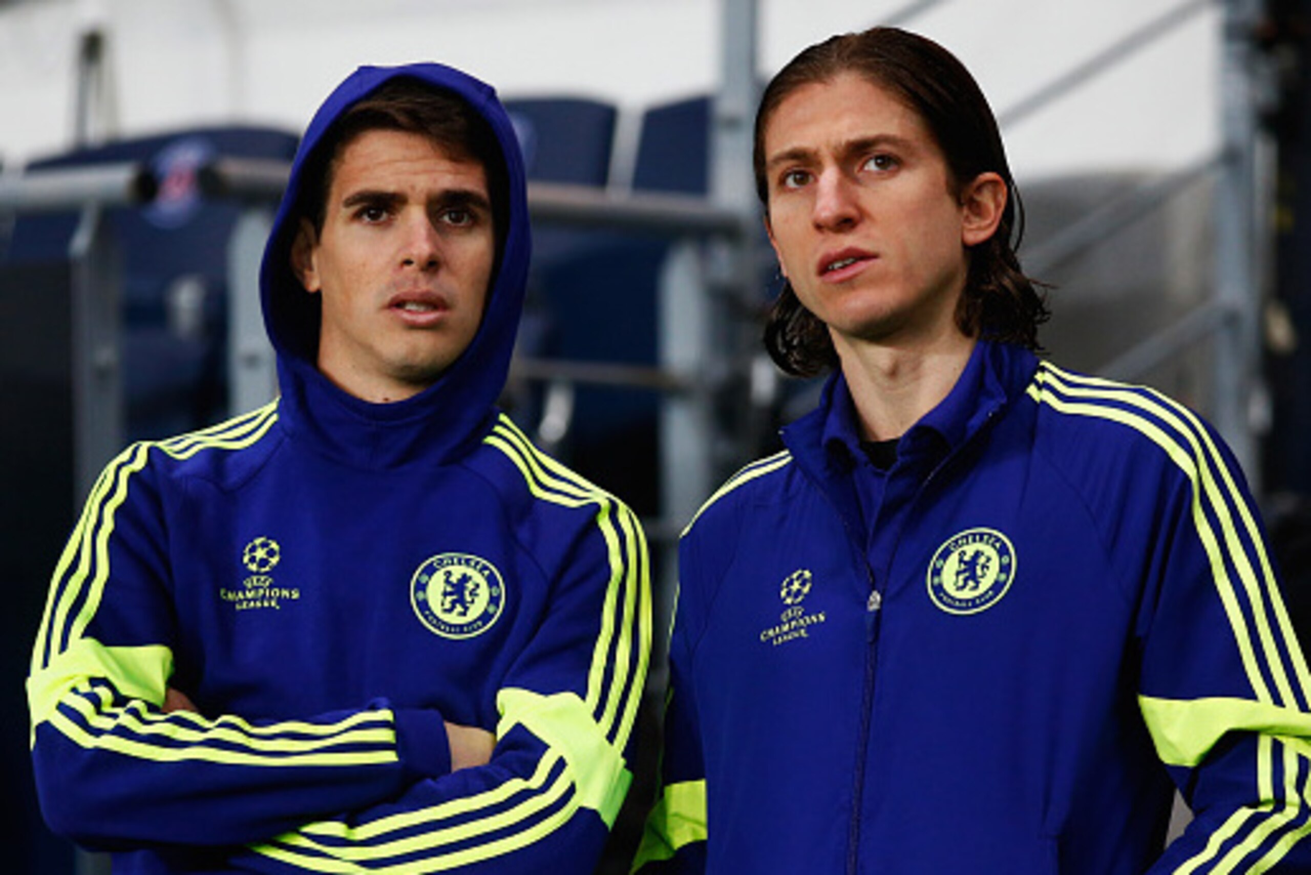 PARIS, FRANCE - FEBRUARY 17:  Oscar (L) and Filipe Luis of Chelsea look on prior to the UEFA Champions League Round of 16 match between Paris Saint-Germain and Chelsea at Parc des Princes on February 17, 2015 in Paris, France.  (Photo by Clive Rose/Getty 