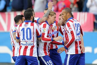 MADRID, SPAIN - APRIL 07:  Fernando Torres of Club Atletico de Madrid celebrates with teammates after Mikel Gonzalez (unseen) of Real Sociedad scored an own goal during the La Liga match between Club Atletico de Madrid and Real Sociedad at Vicente Caldero