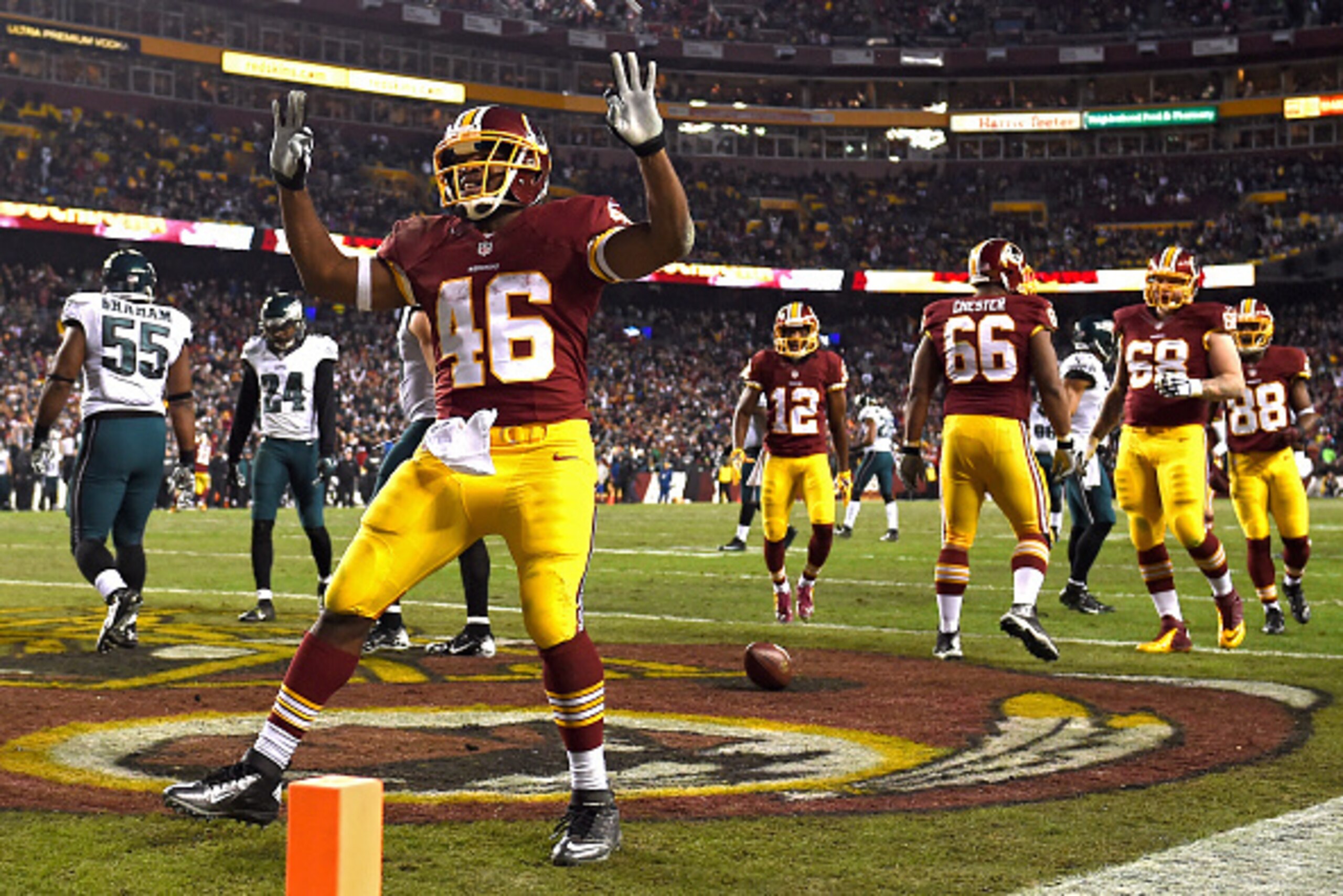 LANDOVER, MD - DECEMBER 20: Running back Alfred Morris #46 of the Washington Redskins celebrates a touchdown against the Philadelphia Eagles in the first half at FedExField on December 20, 2014 in Landover, Maryland. The Washington Redskins won, 27-24. (P